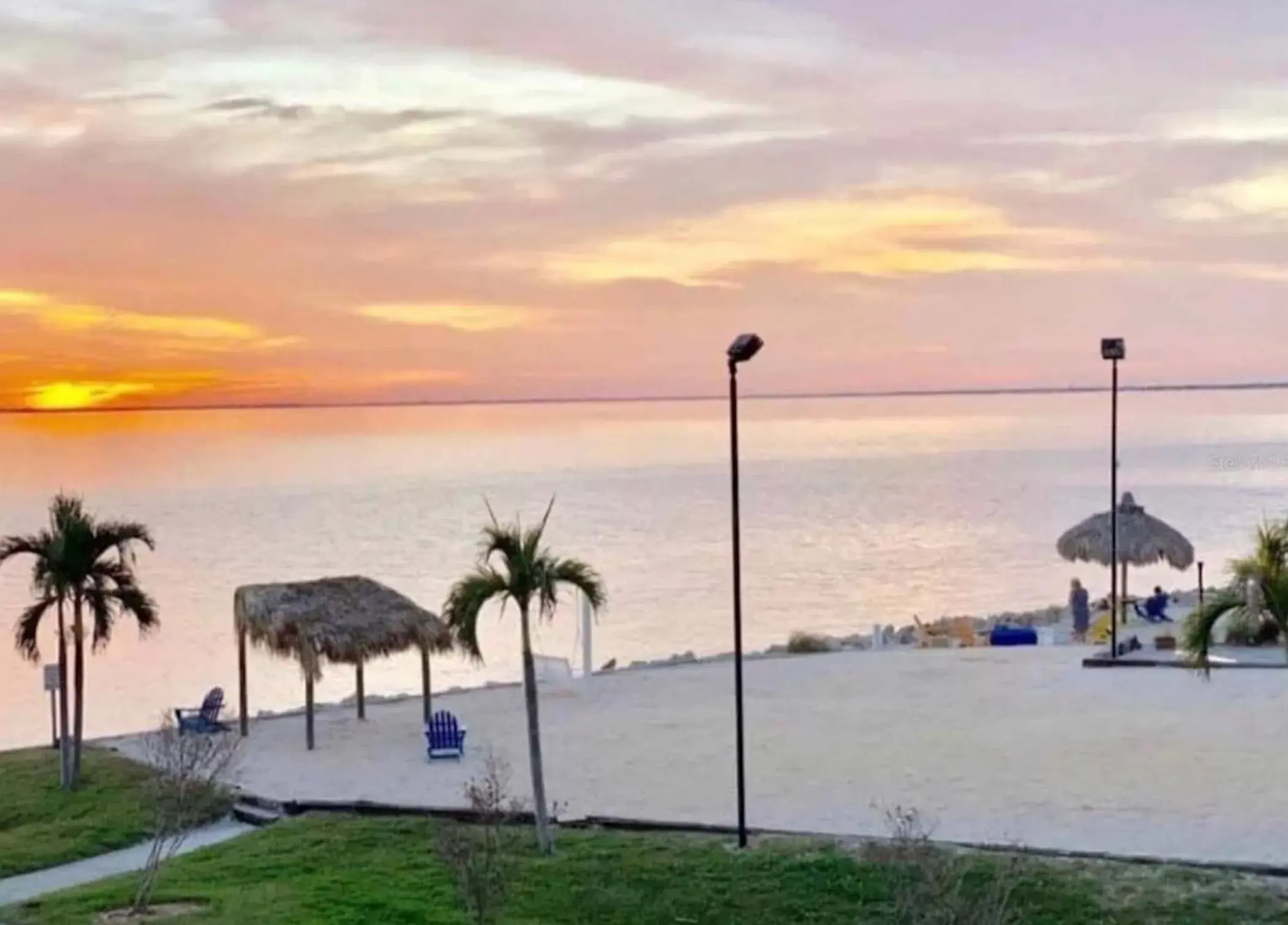 Beach in 2 Bed Condo with Balcony Facing Pool and Sunsets!