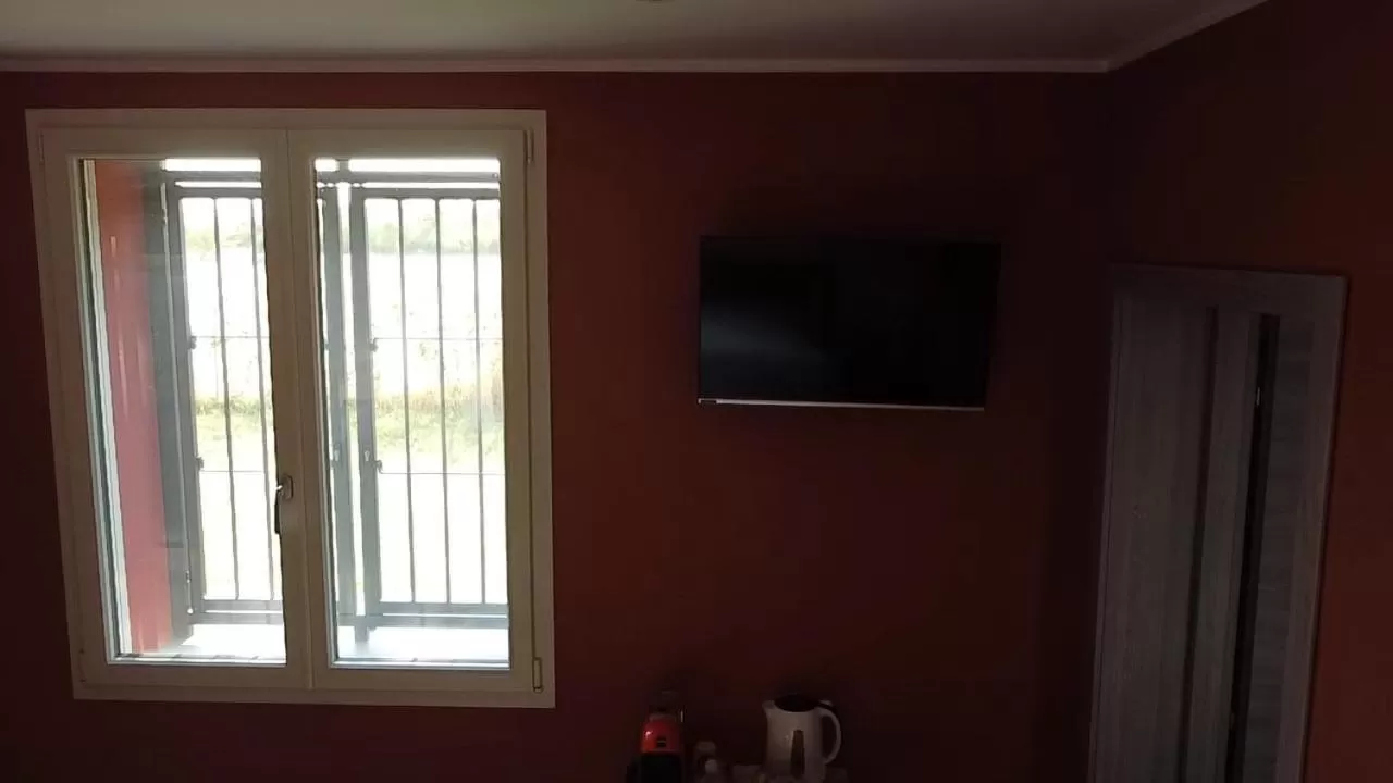 TV/Entertainment Center in Sala dell Estate Guest House