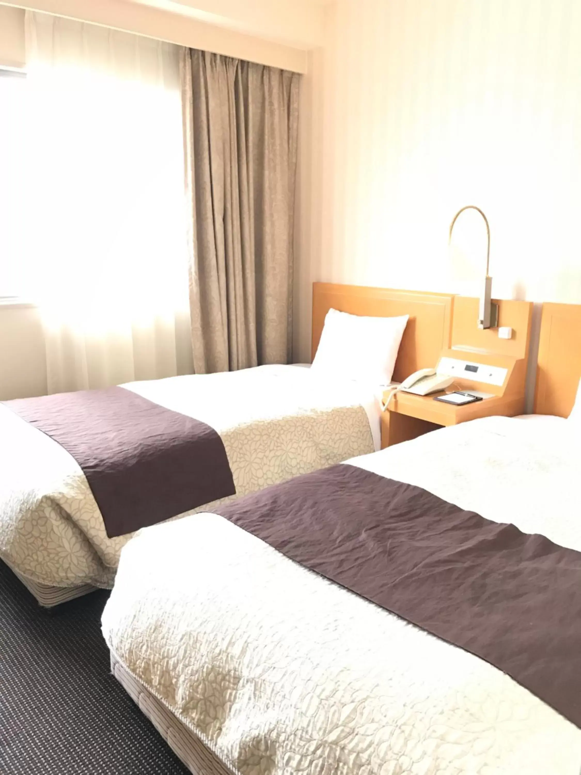 Bed in Numazu River Side Hotel