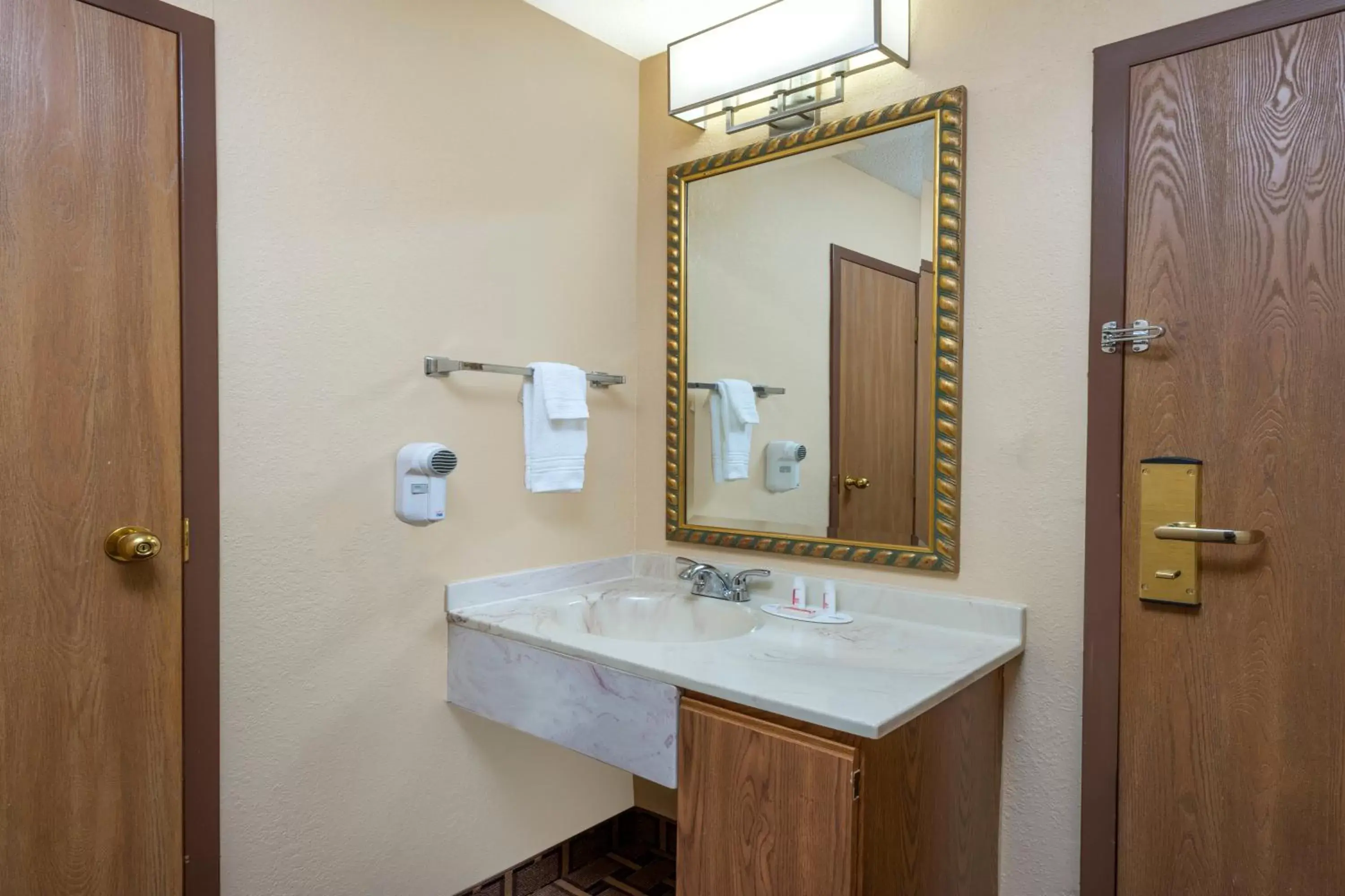 Bathroom in Super 8 by Wyndham Charleston MO