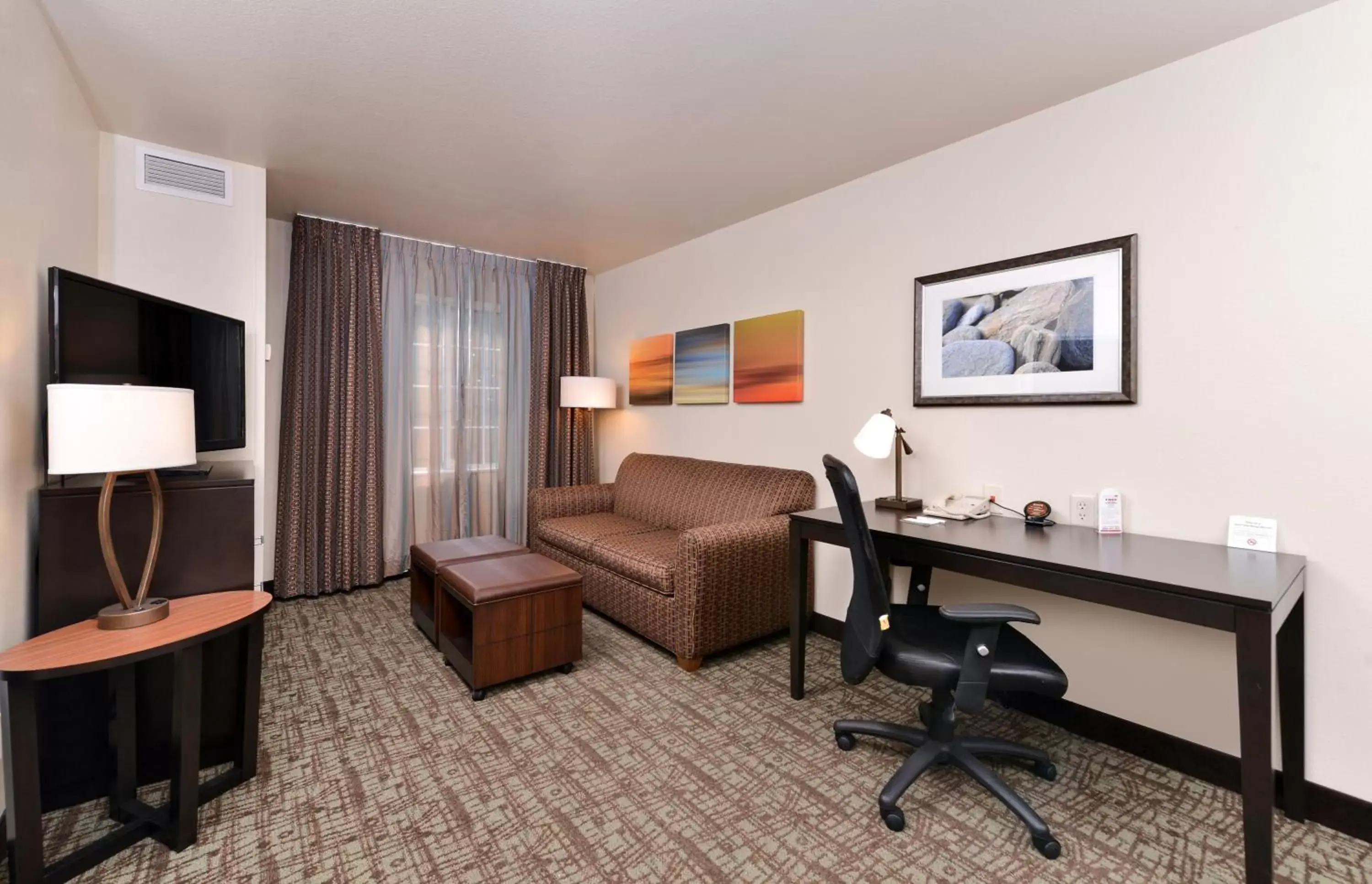 Photo of the whole room, Seating Area in Staybridge Suites Sioux Falls at Empire Mall, an IHG Hotel