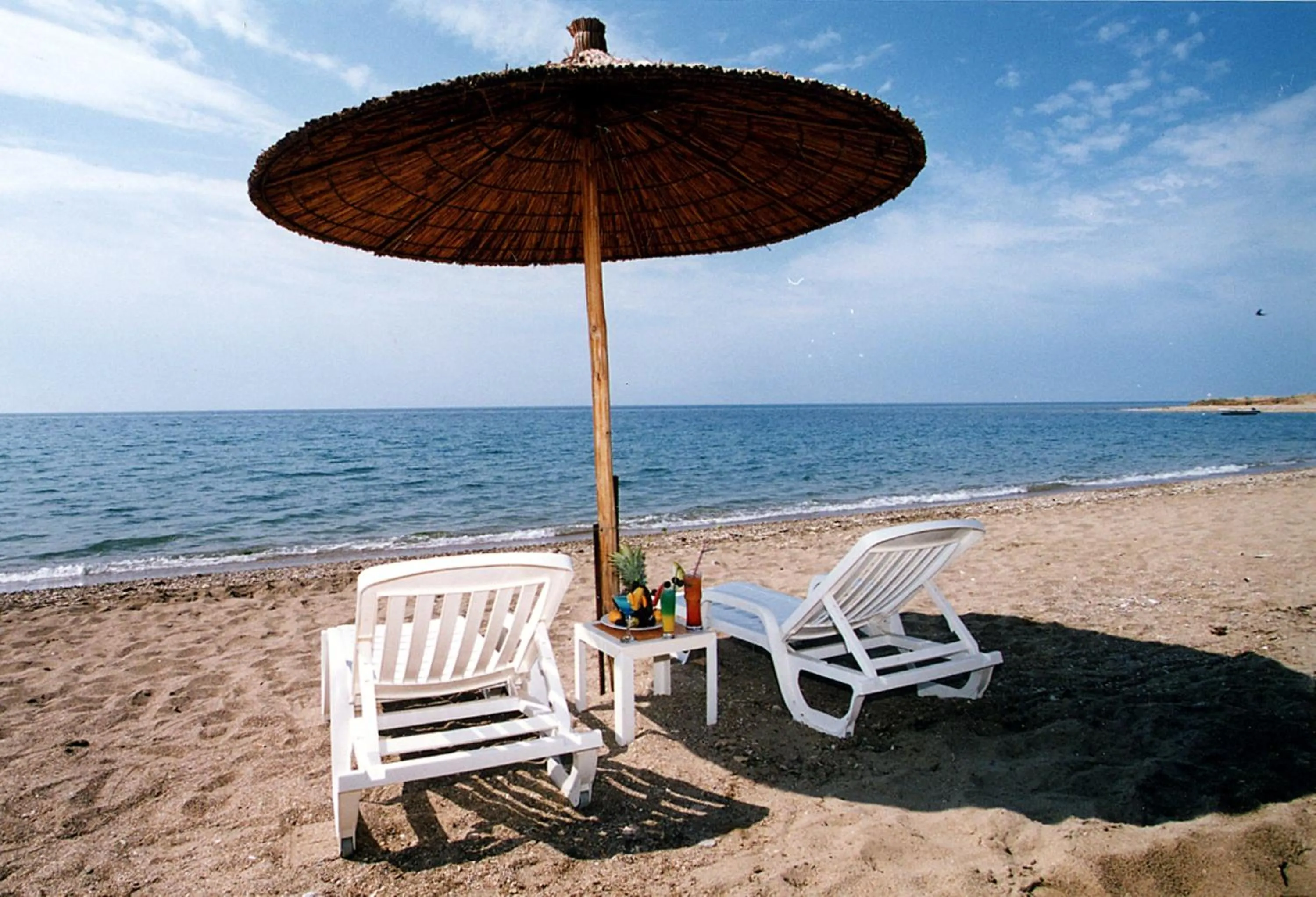 Beach in Ramada Plaza by Wyndham Thraki