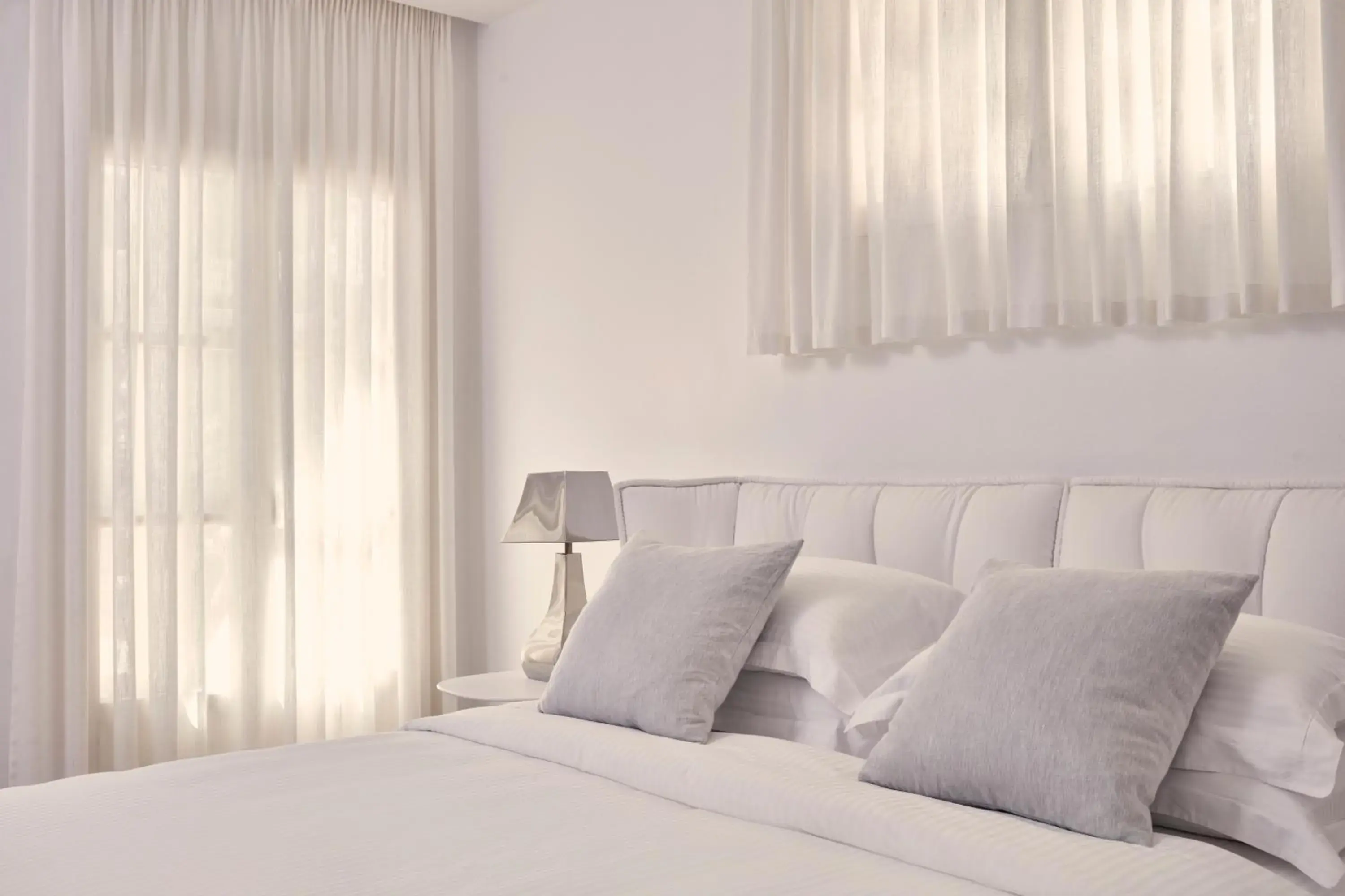 Bed in Myconian Ambassador Relais & Chateaux Bed in Myconian Ambassador Relais & Chateaux