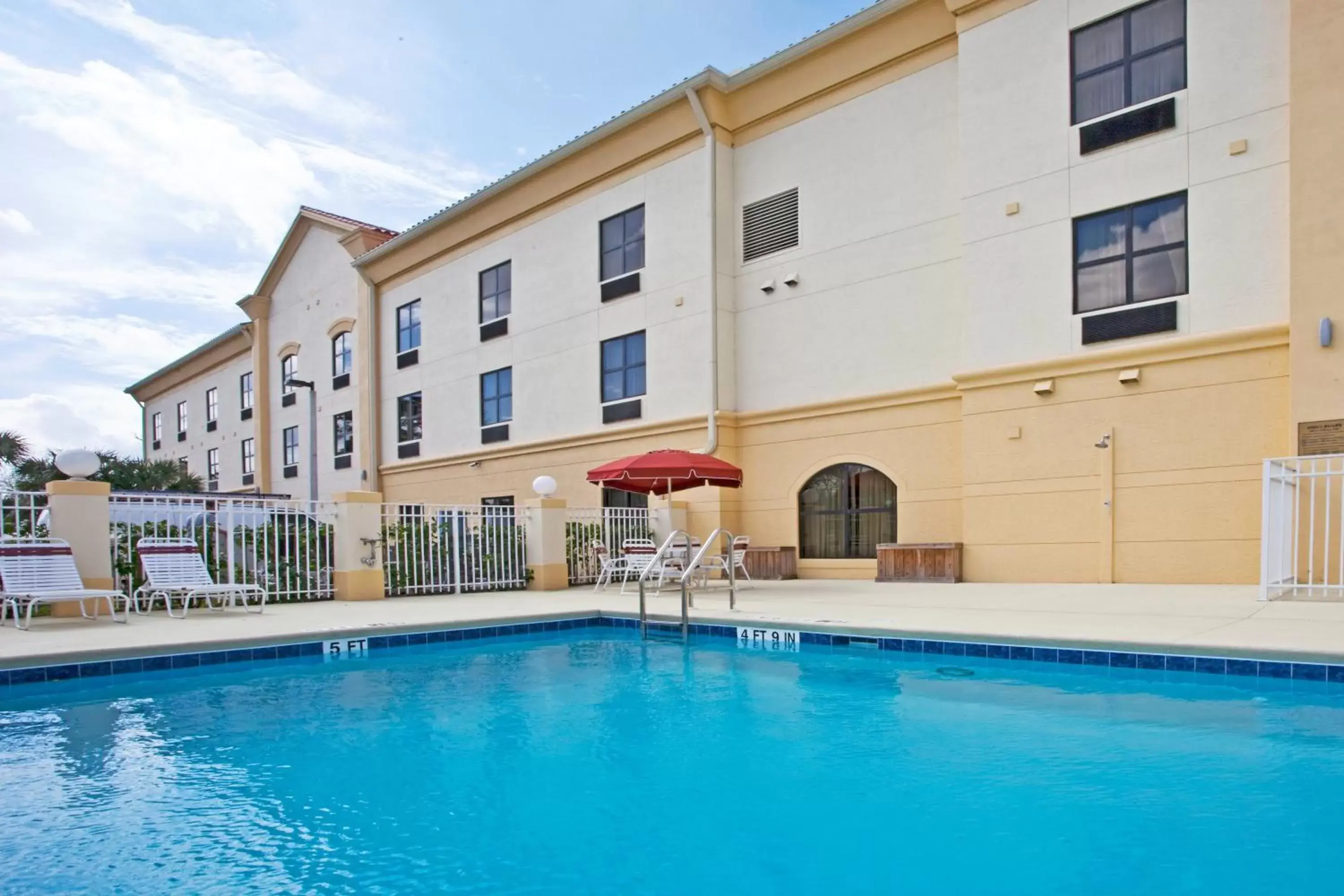 Swimming pool, Property Building in Holiday Inn Express Stuart, an IHG Hotel