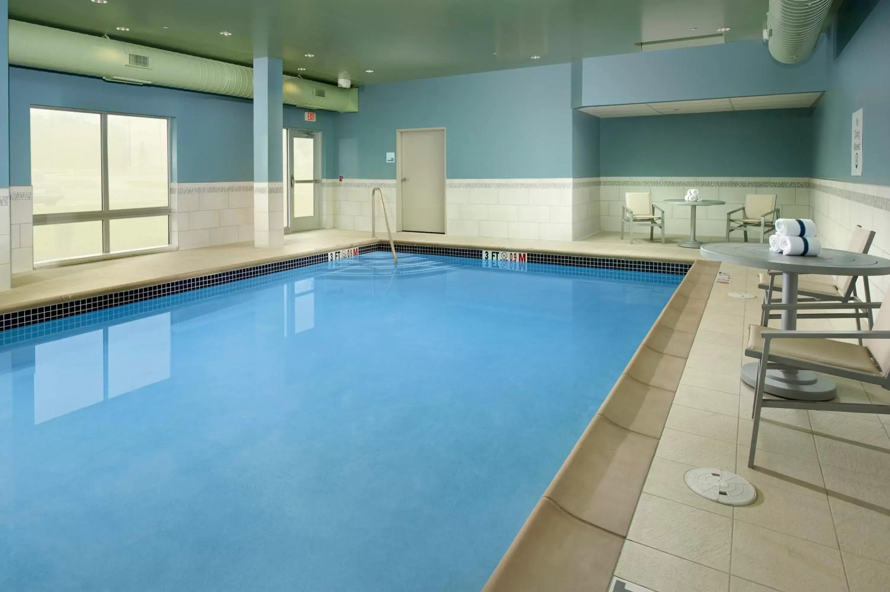 Swimming Pool in Holiday Inn Express & Suites by IHG Altoona, an IHG Hotel