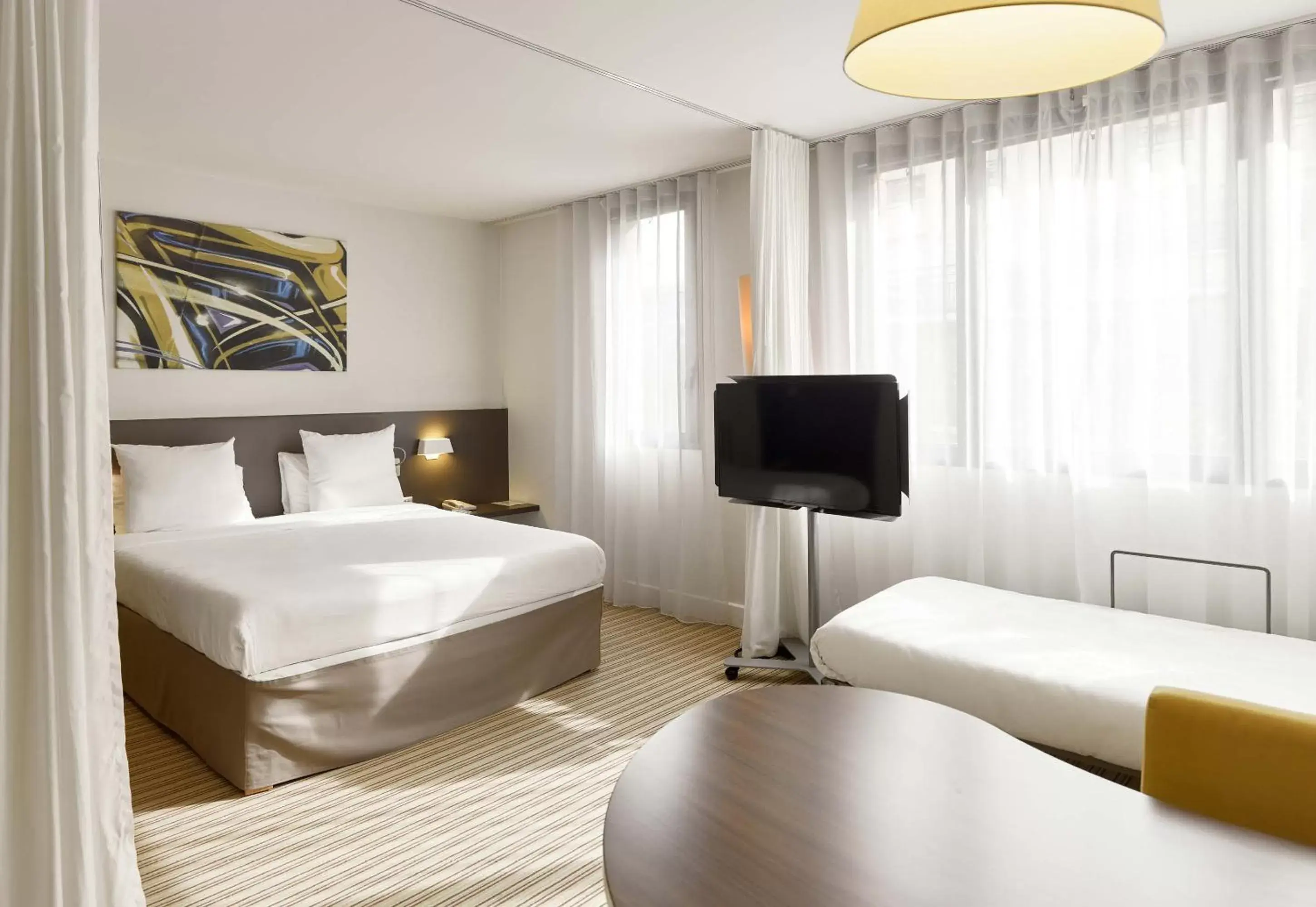 Photo of the whole room, Bed in Novotel Suites Paris Rueil Malmaison