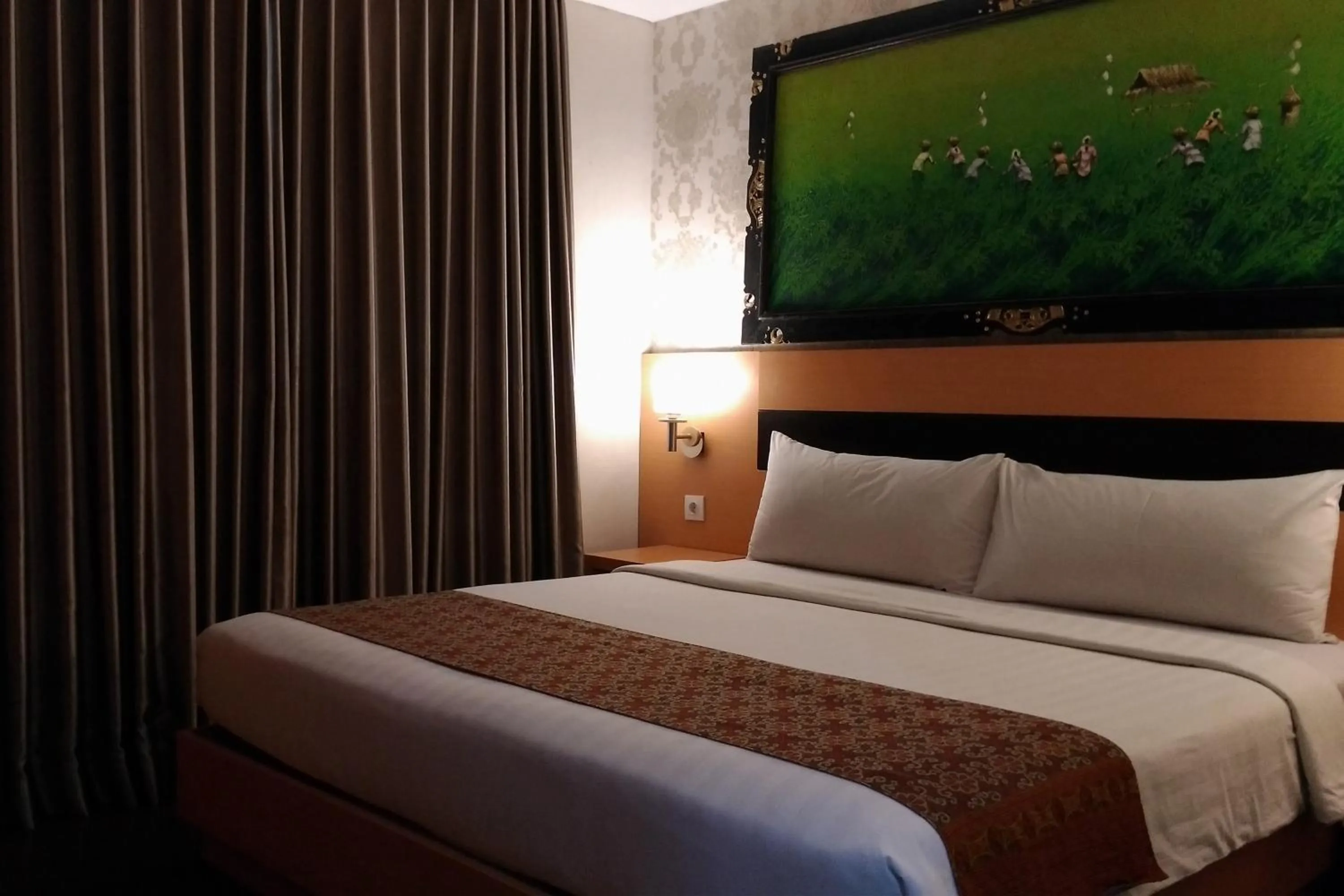 Bed in Grand Puri Saron Hotel Yogyakarta
