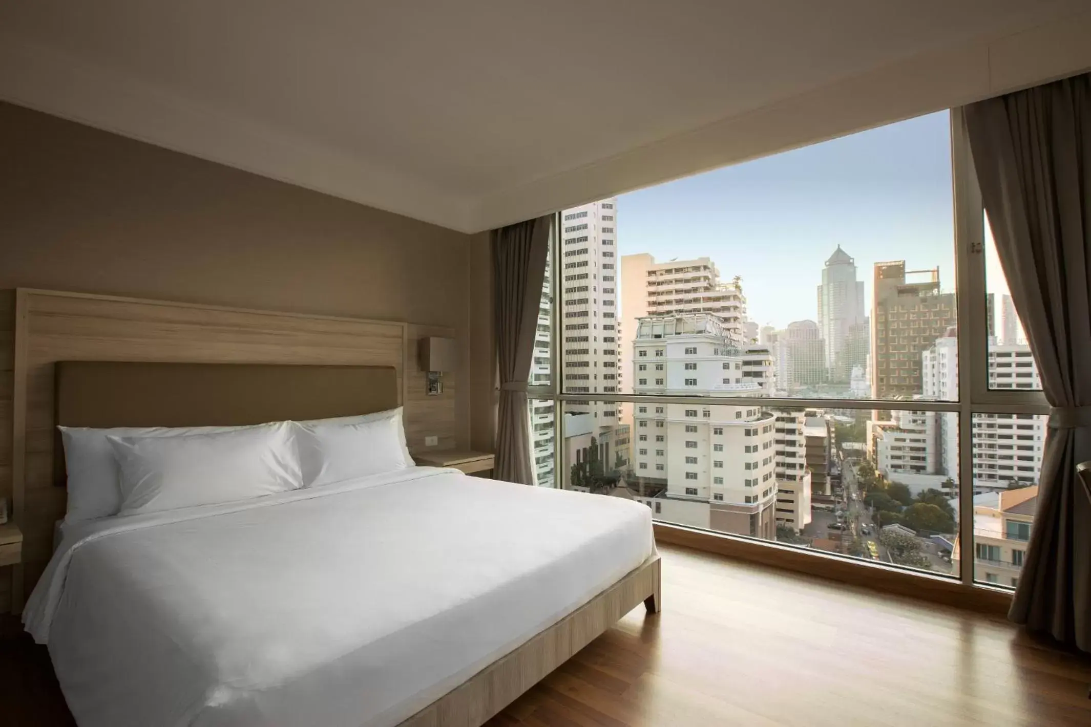 Bedroom in Adelphi Suites Bangkok - SHA Extra Plus