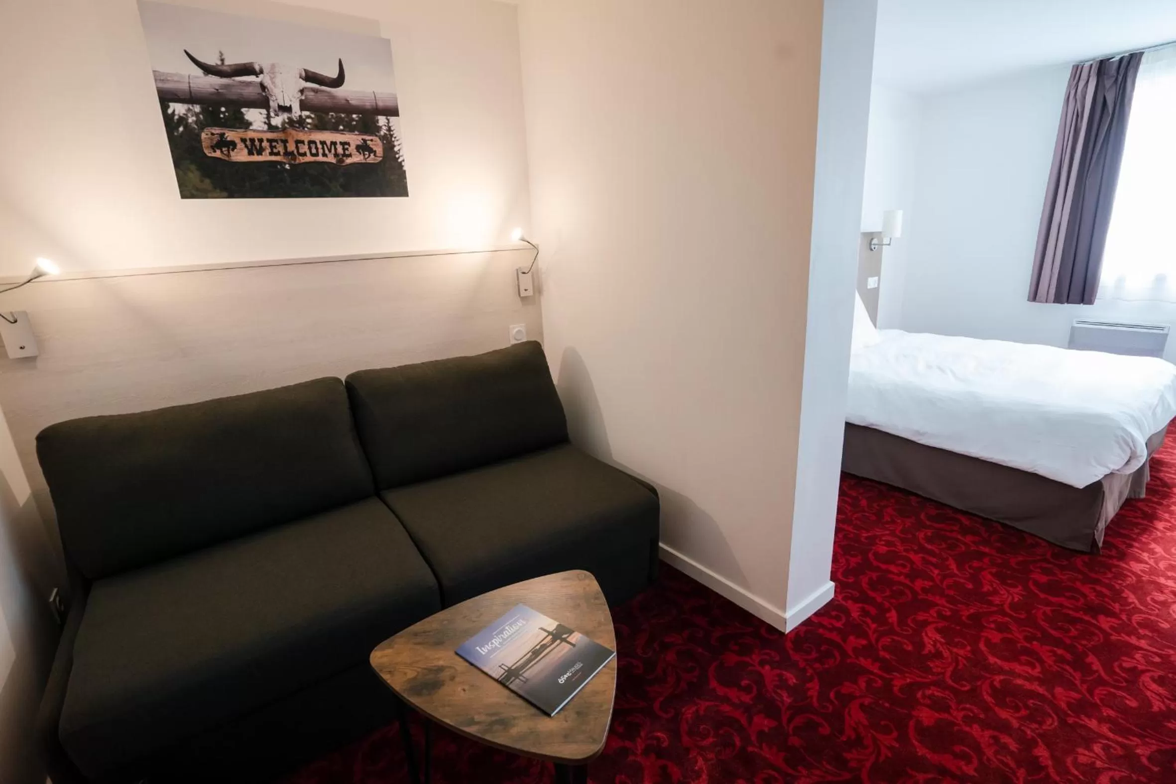 Seating area, Bed in Brit Hotel Essentiel Cholet