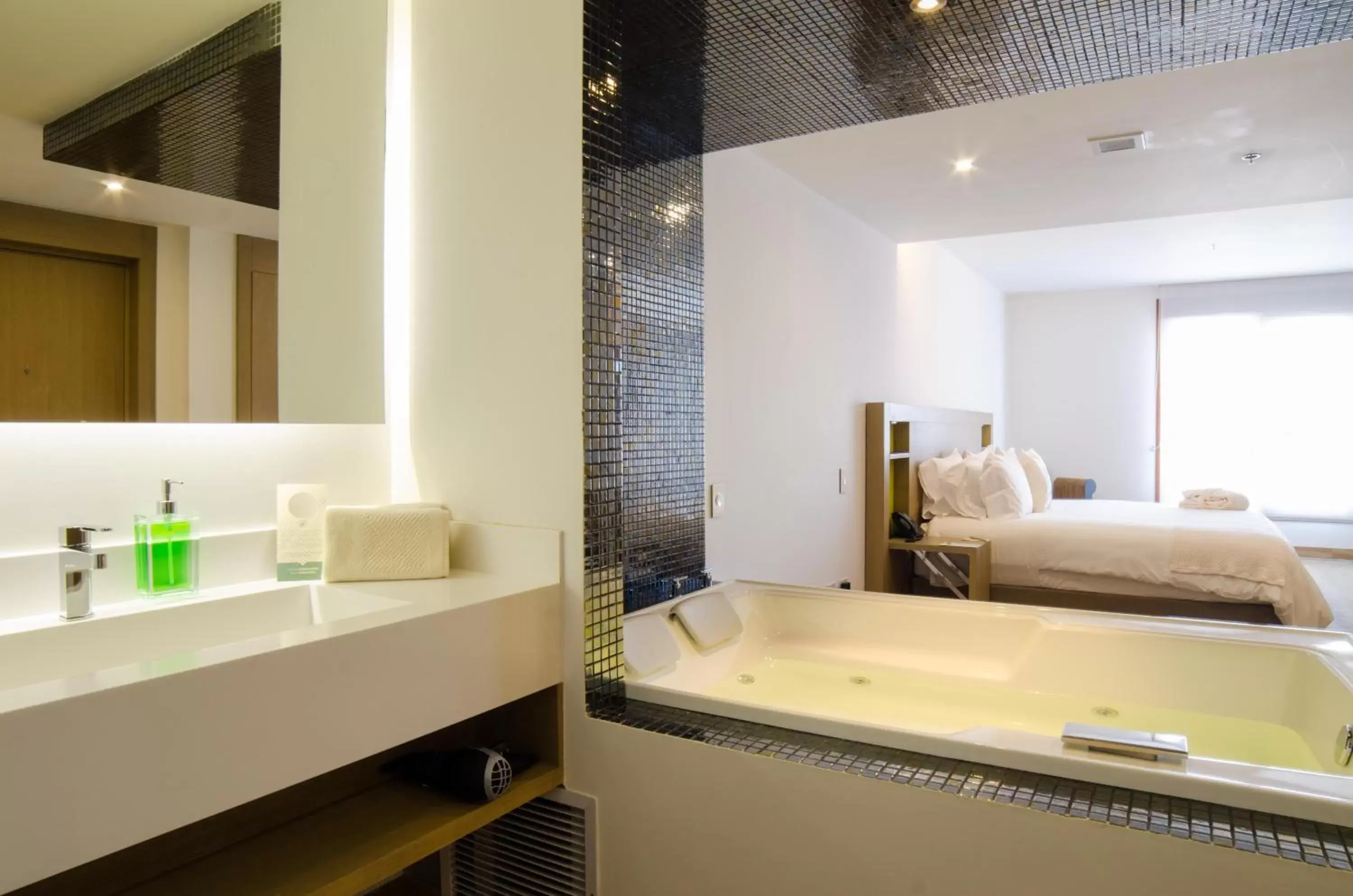 Bed, Bathroom in Biohotel Organic Suites