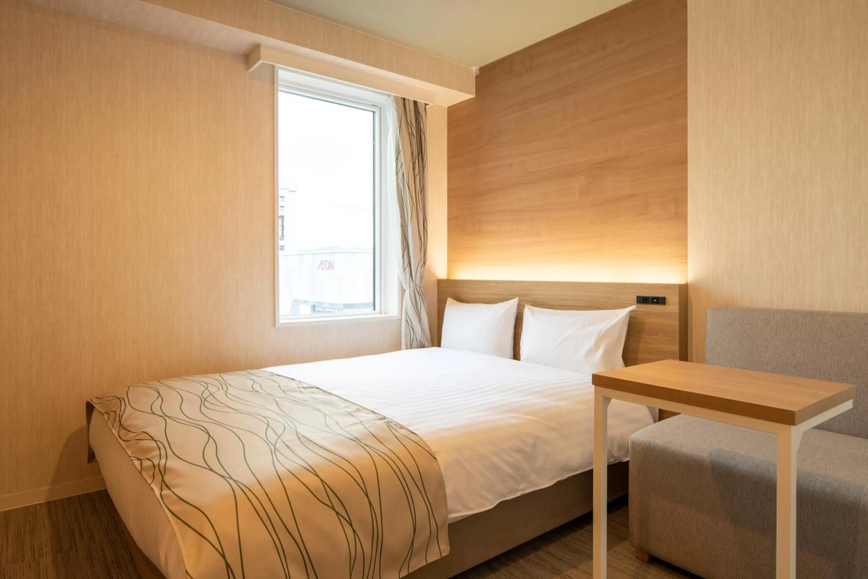 Bed in HOTEL AMANEK Asahikawa