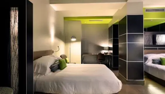 Bed in CityFlatsHotel - Grand Rapids, Ascend Hotel Collection