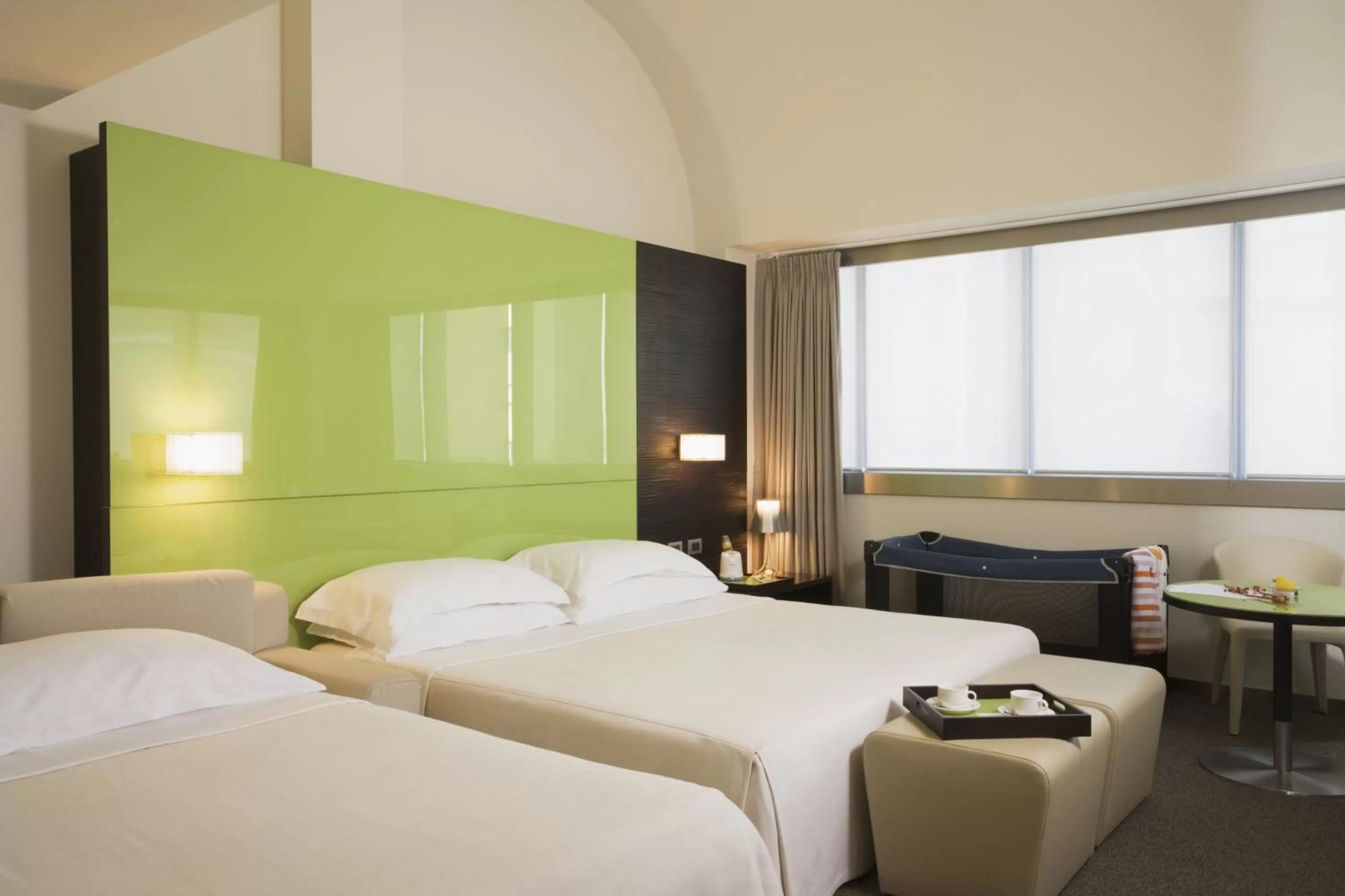 Bed in UNA HOTELS T Hotel Cagliari