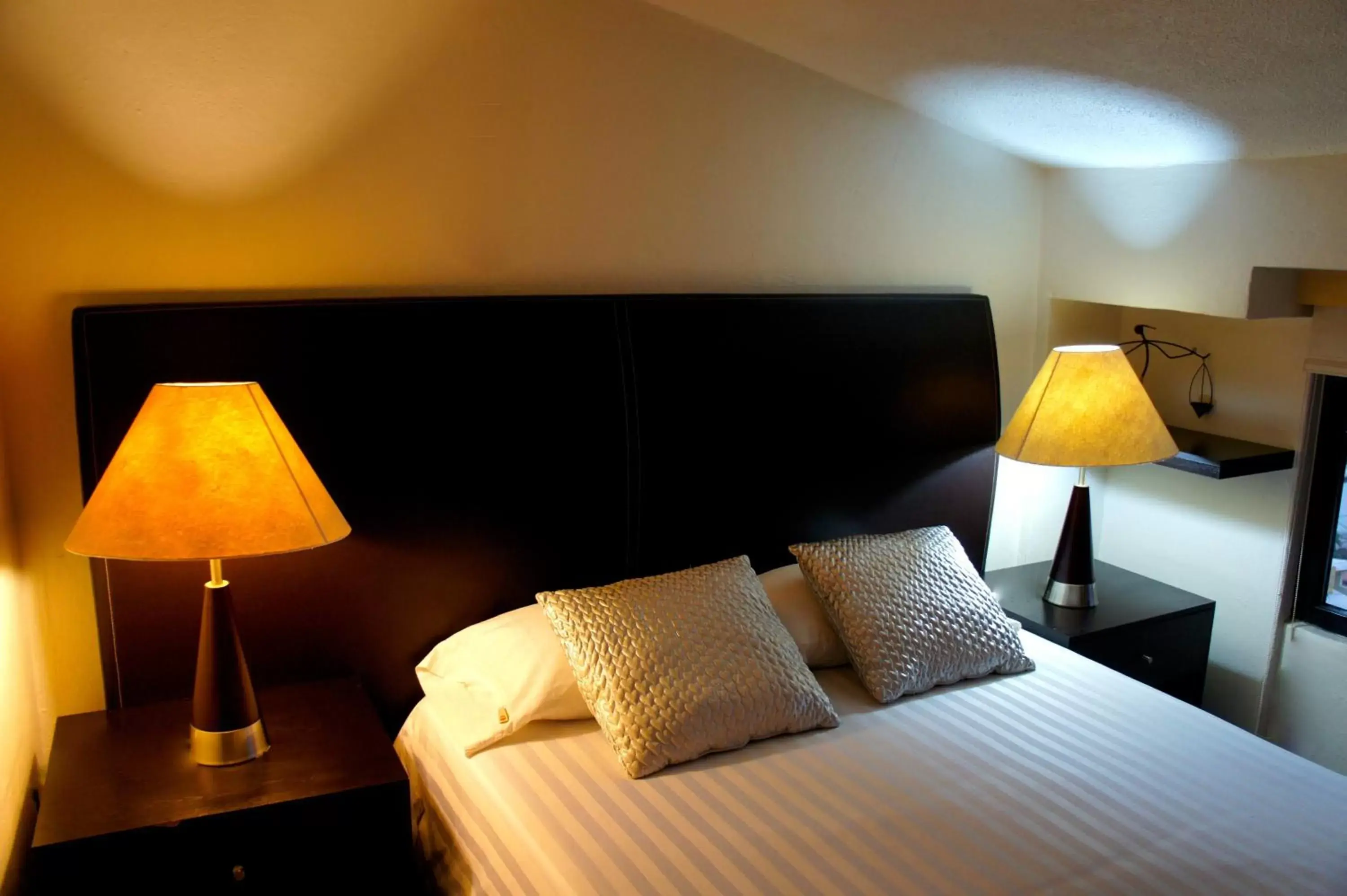Bed in Aztic Hotel and Executive Suites