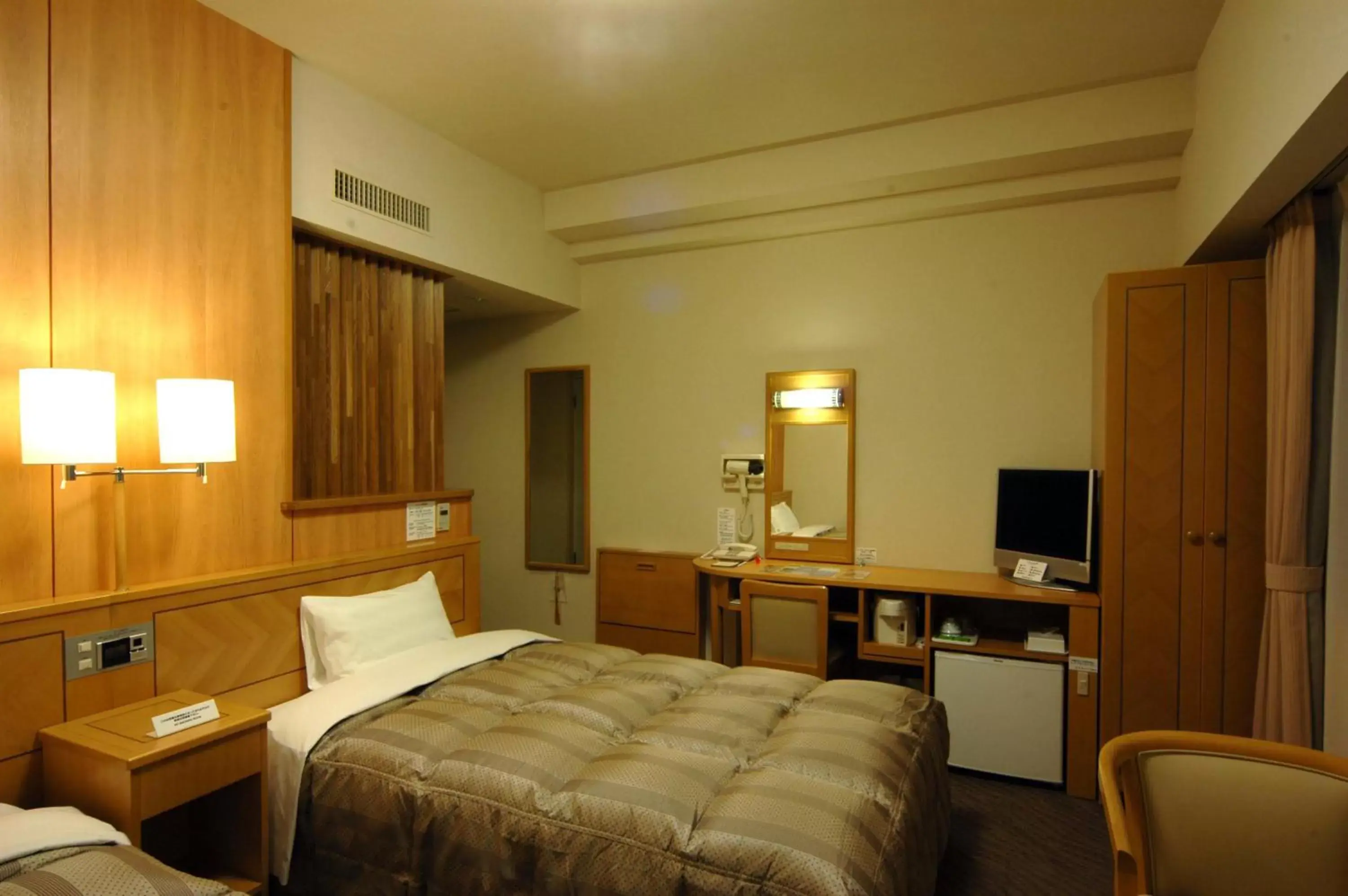 Bed in Hotel Route-Inn Kushiro Ekimae