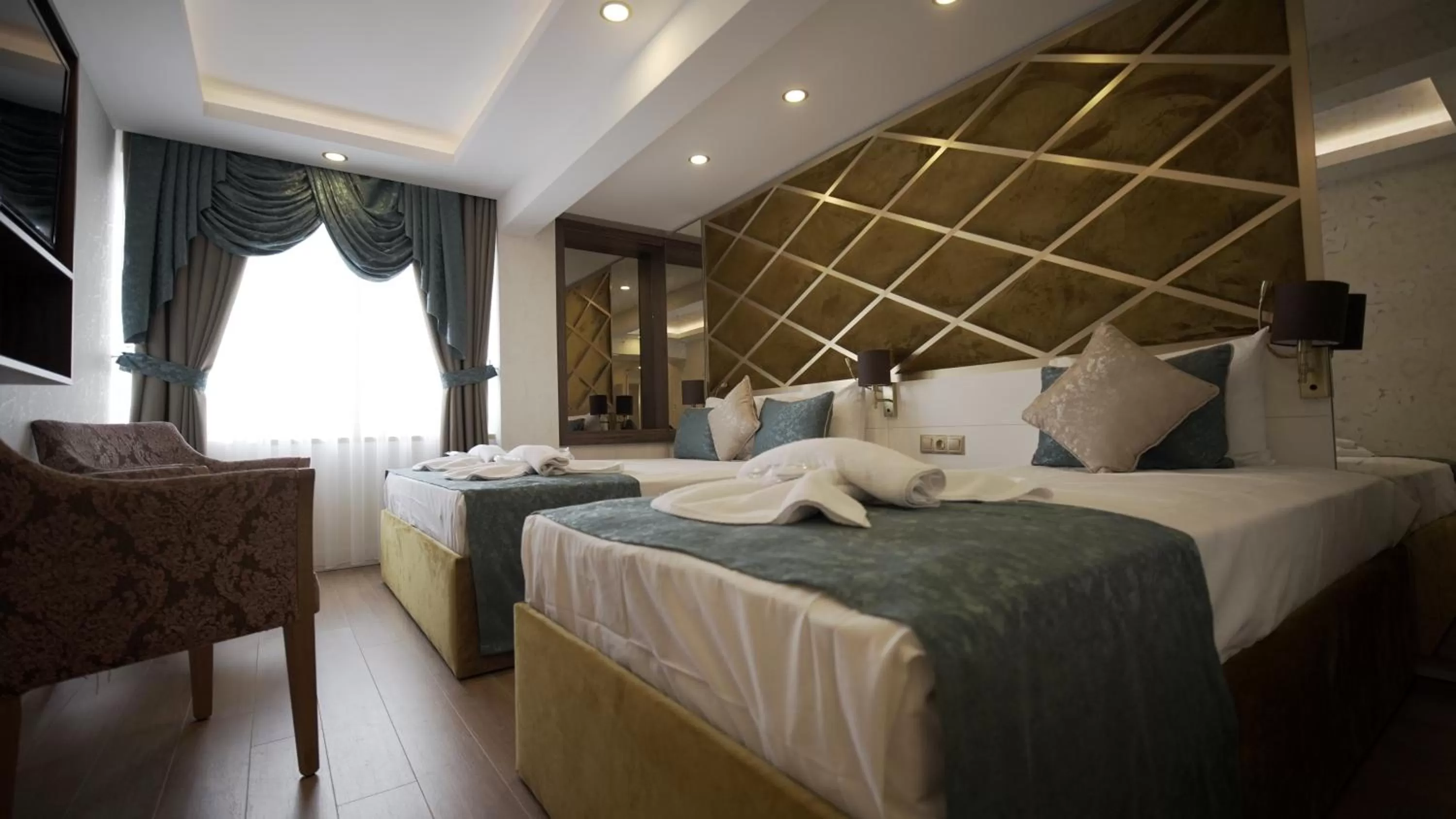 Photo of the whole room, Bed in Burj Al Istanbul