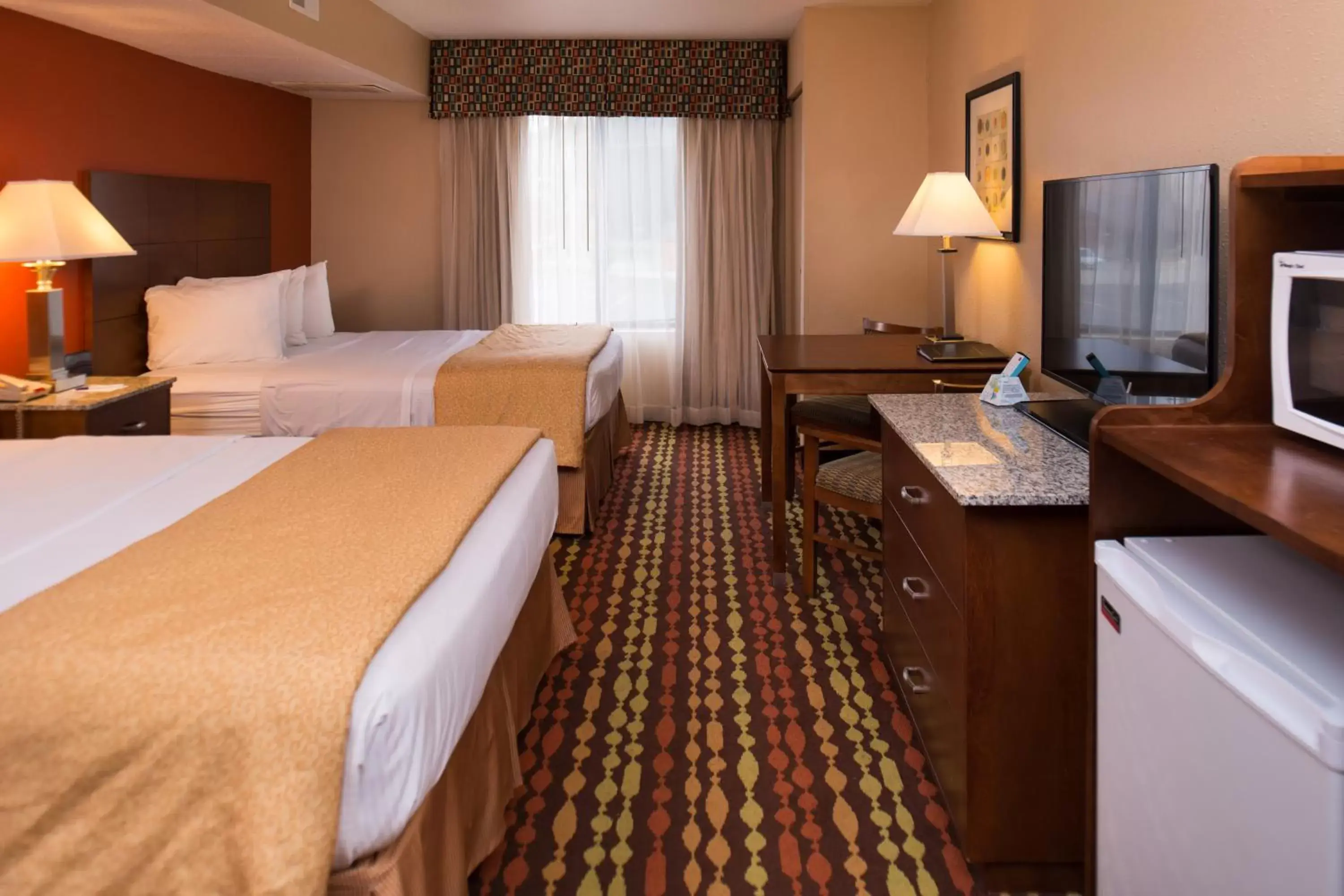 Suite with One King Bed and Two Queen Beds in Best Western Ambassador Inn & Suites