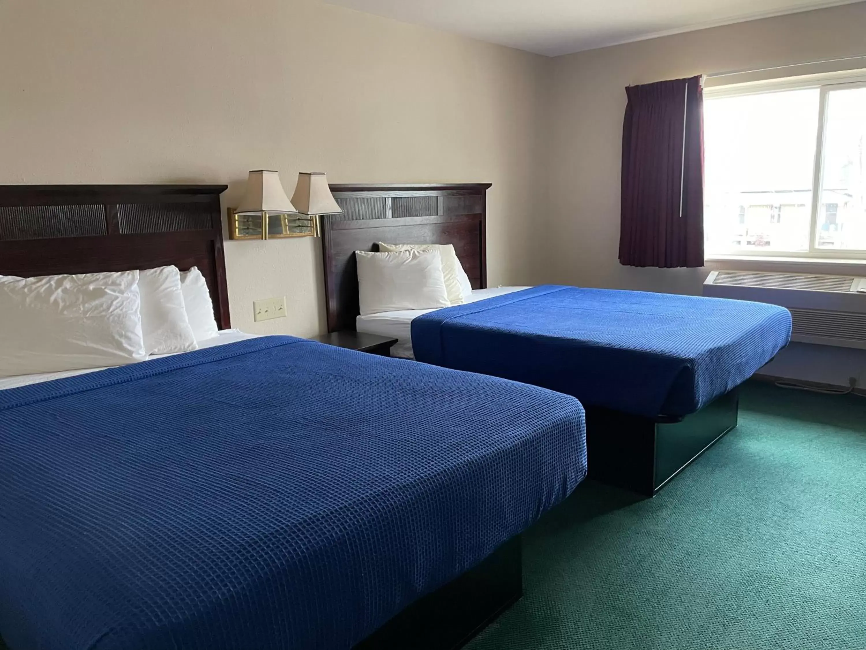 Bed in Heritage Inn Hotel