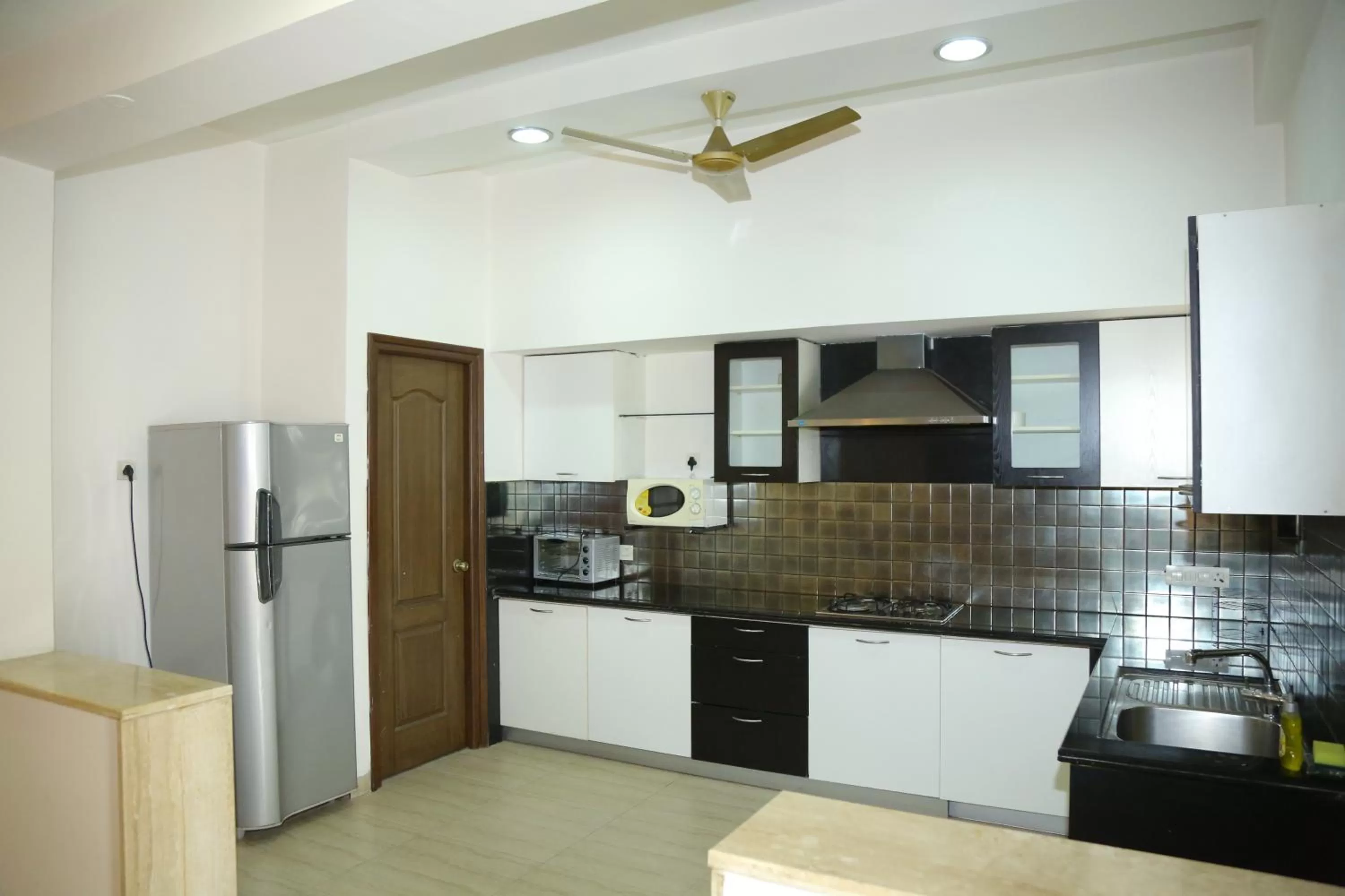 Kitchen or kitchenette in Swan Suites Madhapur