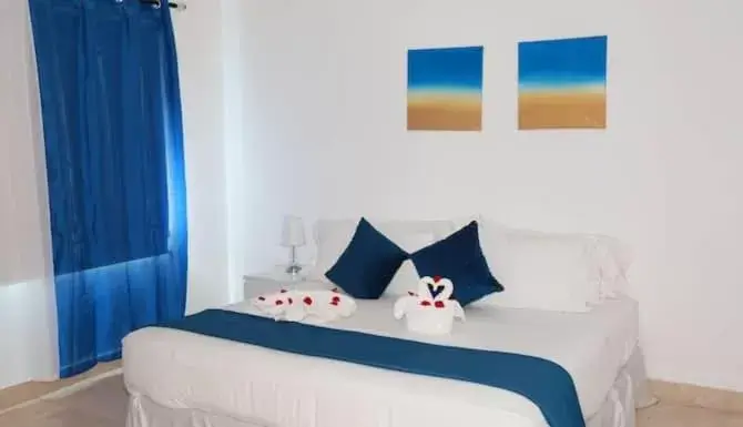 Bed in Beach Front TGR Hotels and Resorts