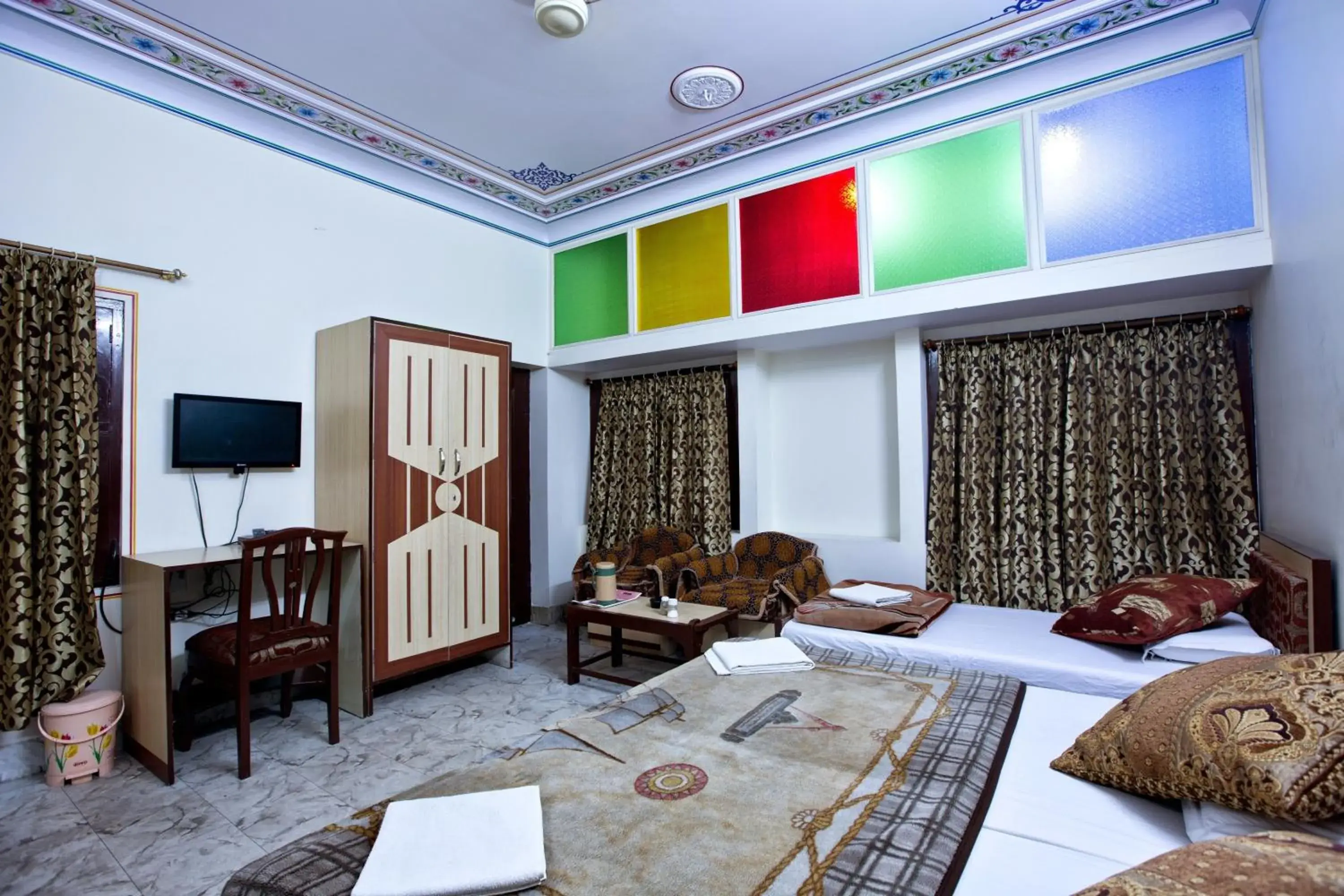 Bed, Seating Area in Hotel Kalyan