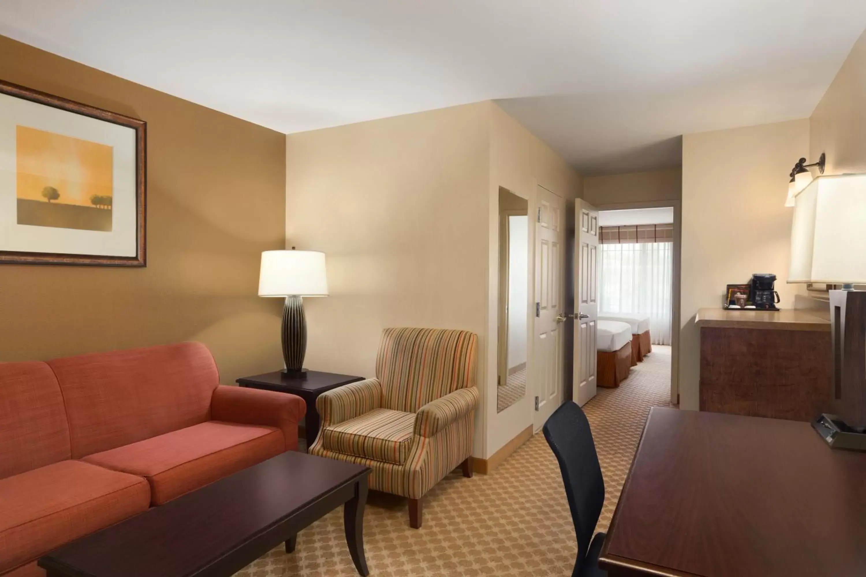 Living room, Seating Area in Country Inn & Suites by Radisson, Ontario at Ontario Mills, CA