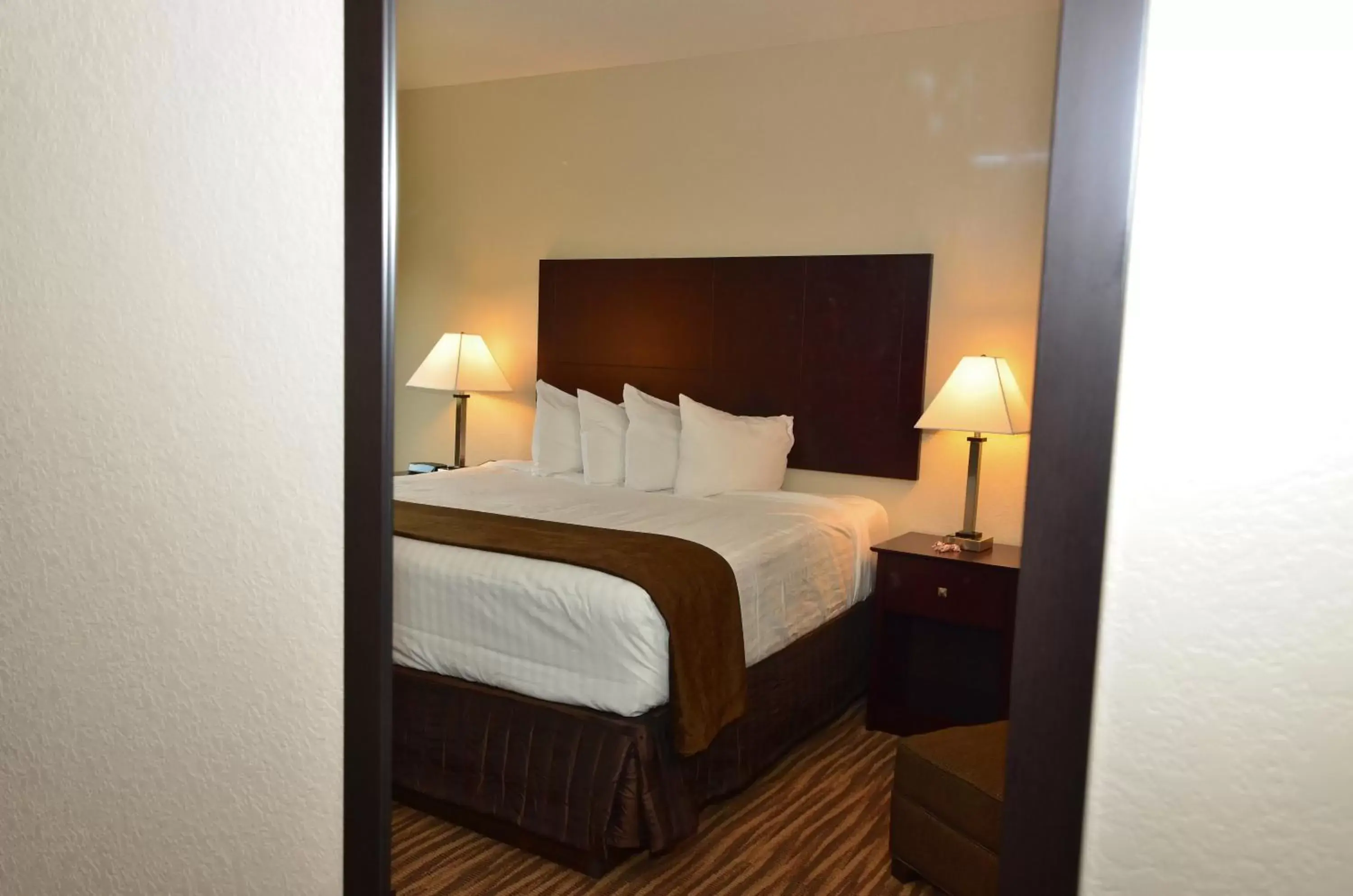 Bed in Cobblestone Inn & Suites - Clarion