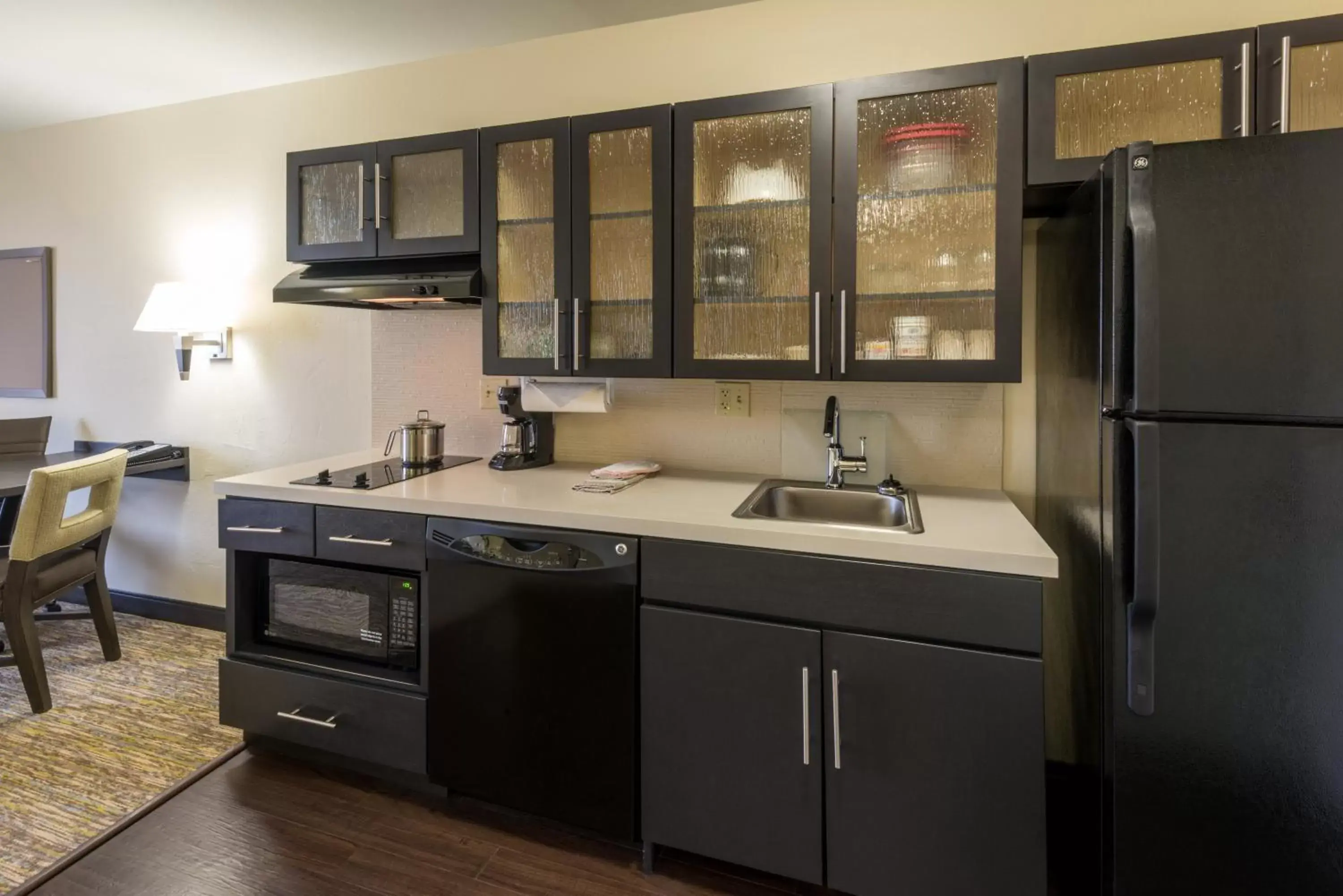 Bedroom, Kitchen/Kitchenette in Candlewood Suites Del City, an IHG Hotel