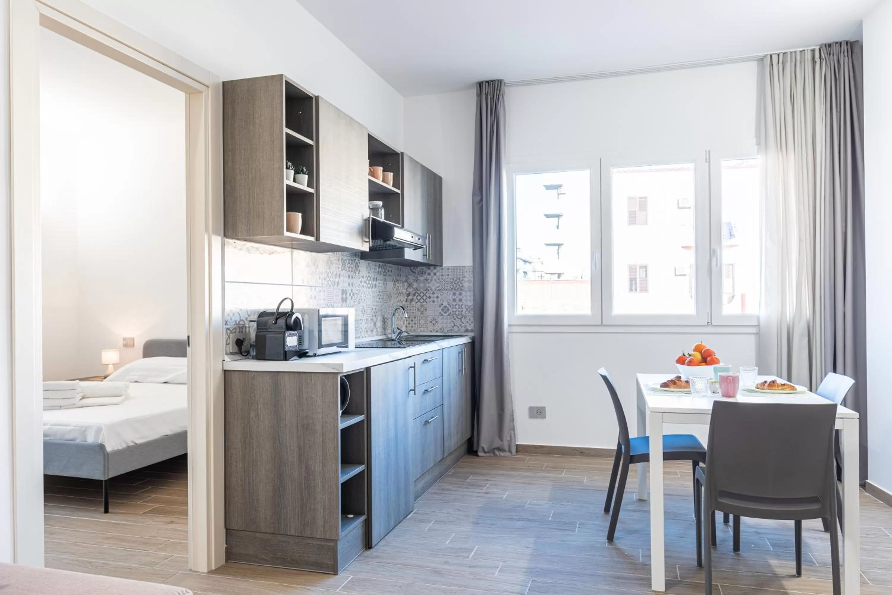 Kitchen or kitchenette, Bed in Solemar Sicilia - Multi Suite