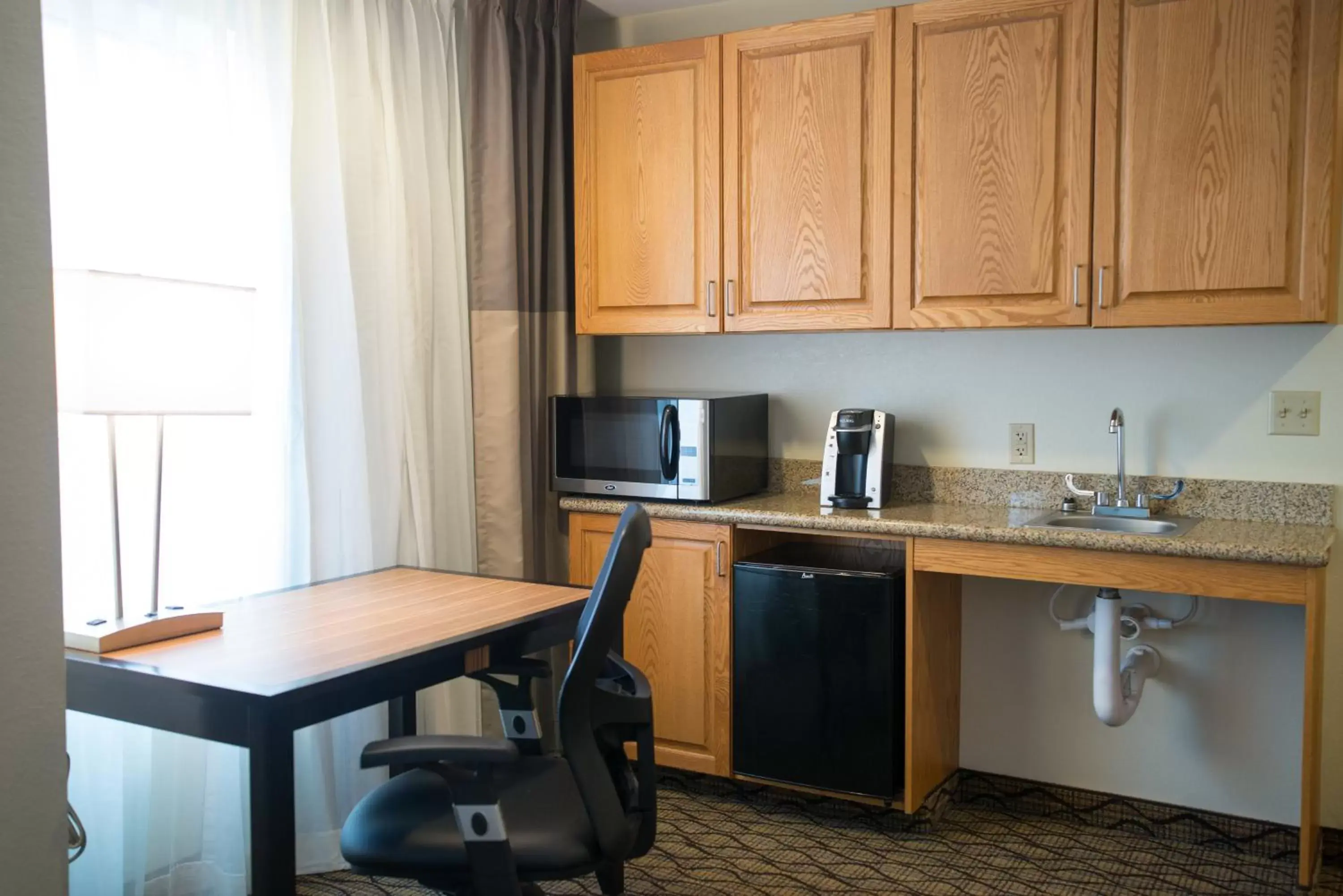 Kitchen/Kitchenette in Holiday Inn Express Hotel & Suites Chanhassen, an IHG Hotel