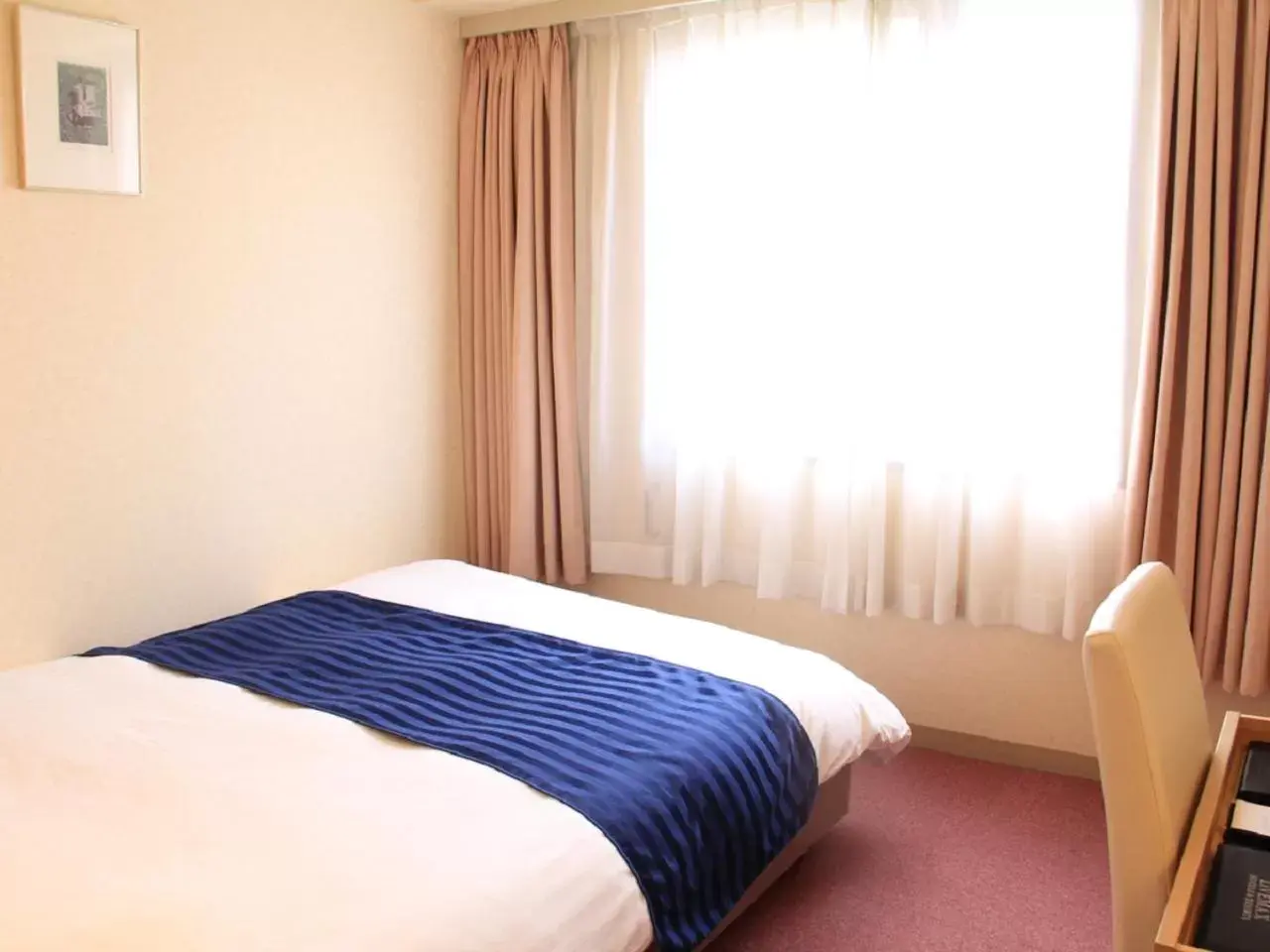 Bed in HOTEL LiVEMAX BUDGET Kagoshima