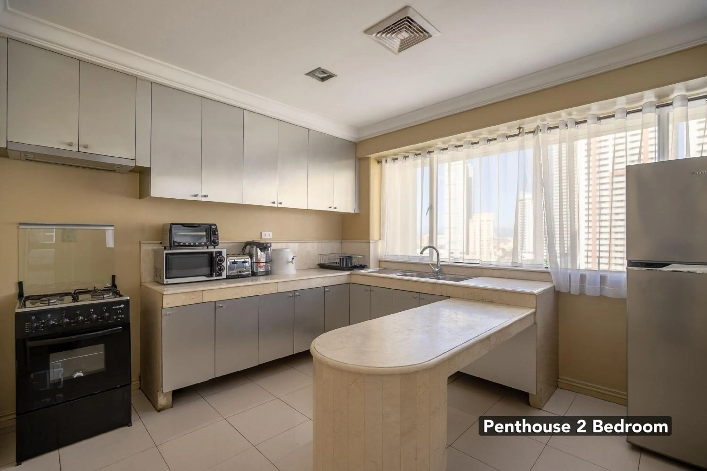 Kitchen or kitchenette in Orchid Garden Suites