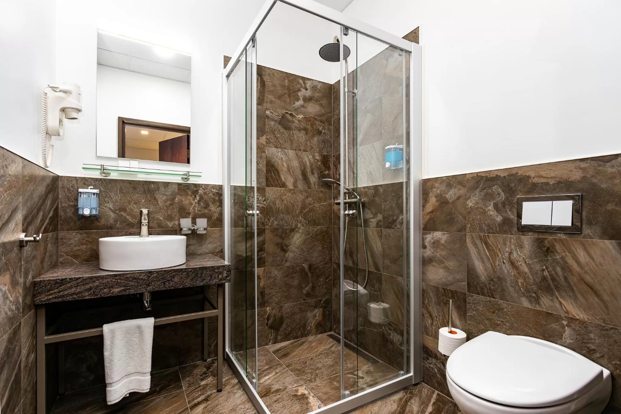 Toilet in Adoryal Hotell