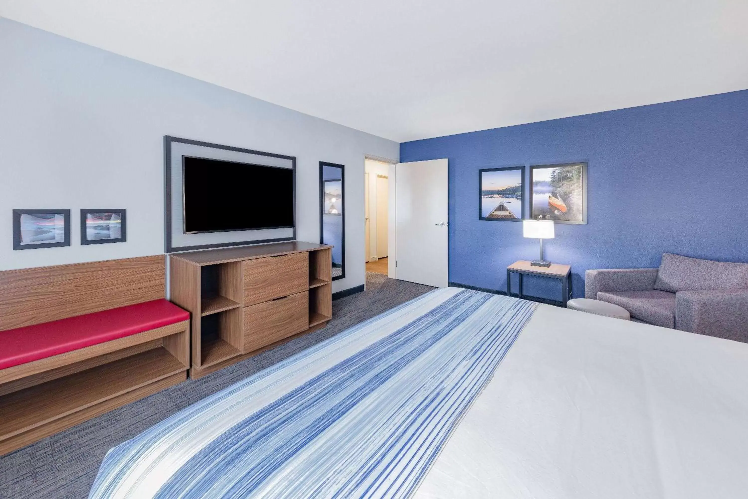 Bed in AmericInn by Wyndham International Falls