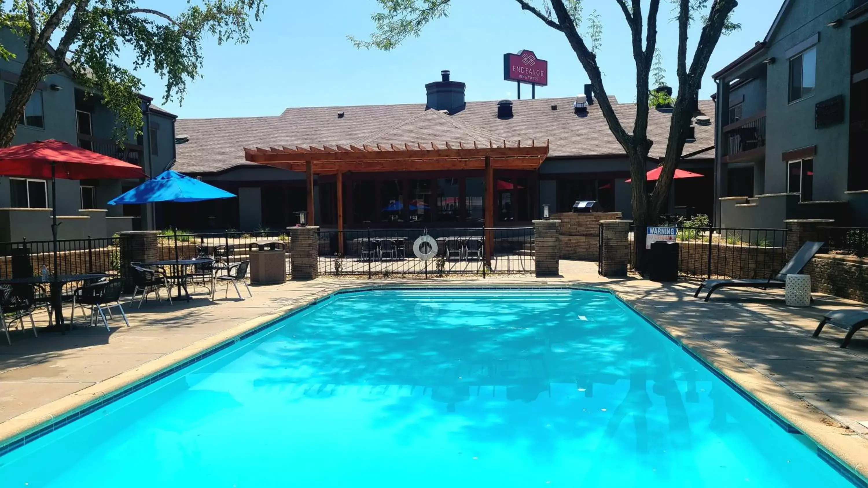 Swimming Pool in Endeavor Inn & Suites, Trademark Collection by Wyndham