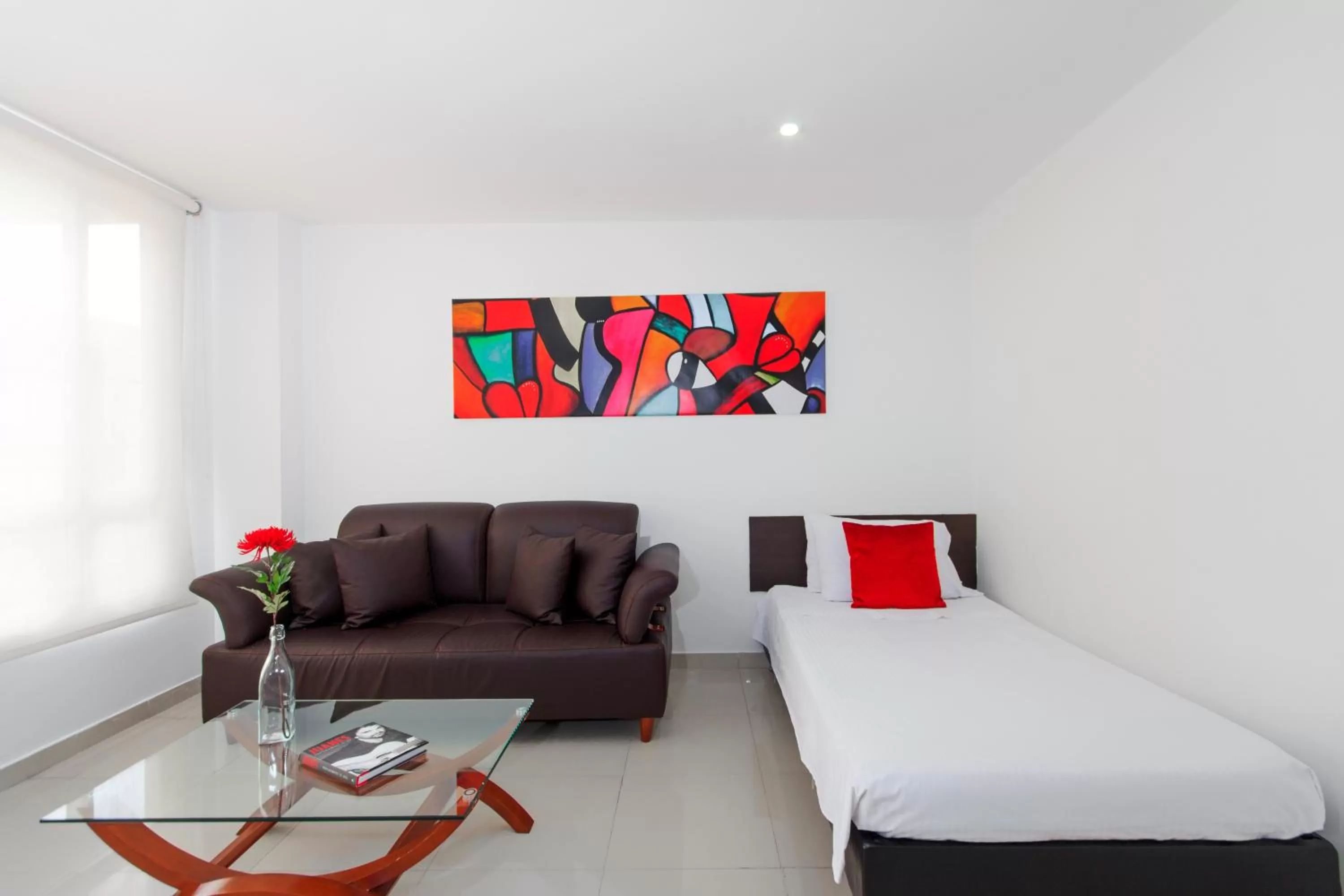 Living room, Bed in 122 Plaza Apartahotel