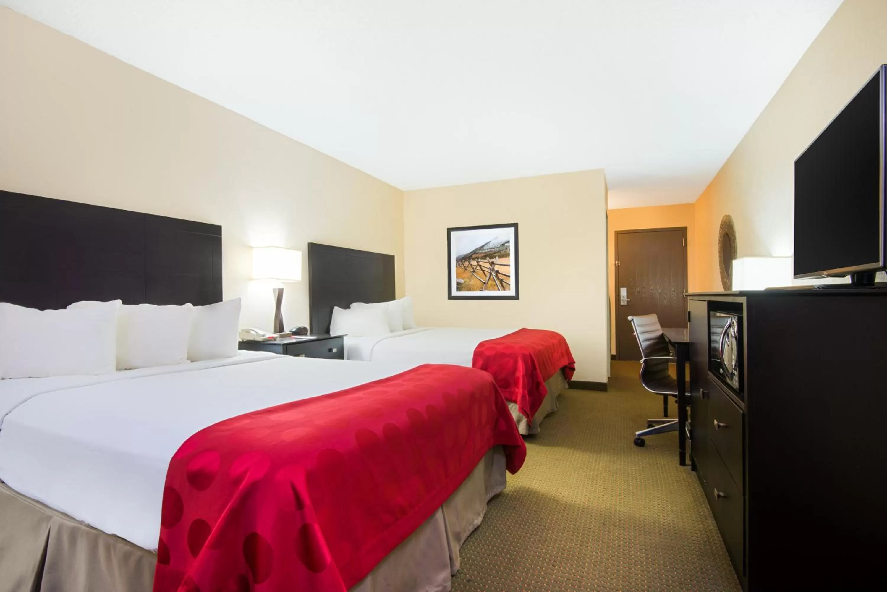 Bed in Ramada Plaza by Wyndham Gillette Conference Center