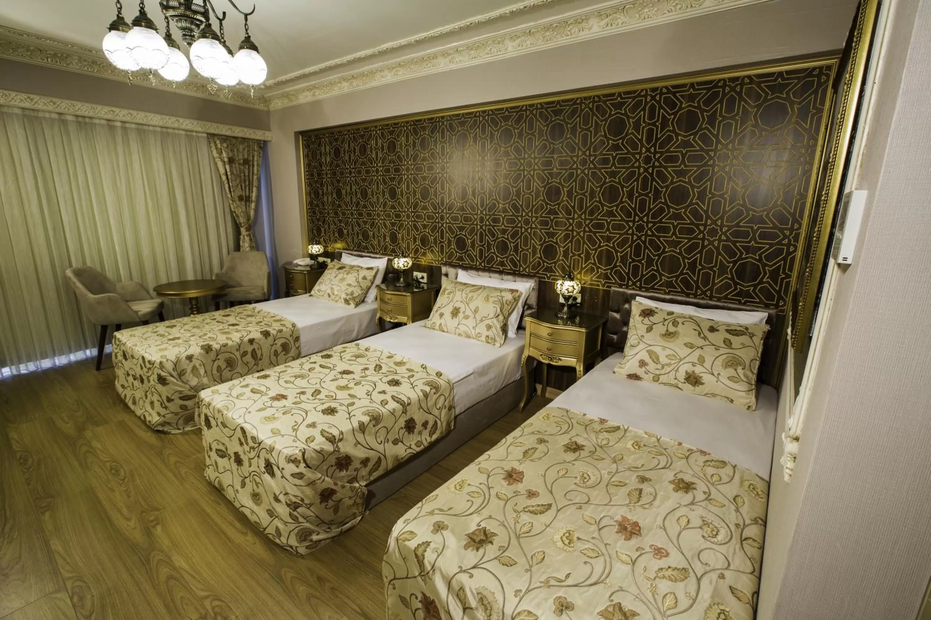 Bed in Empire Suite Hotel