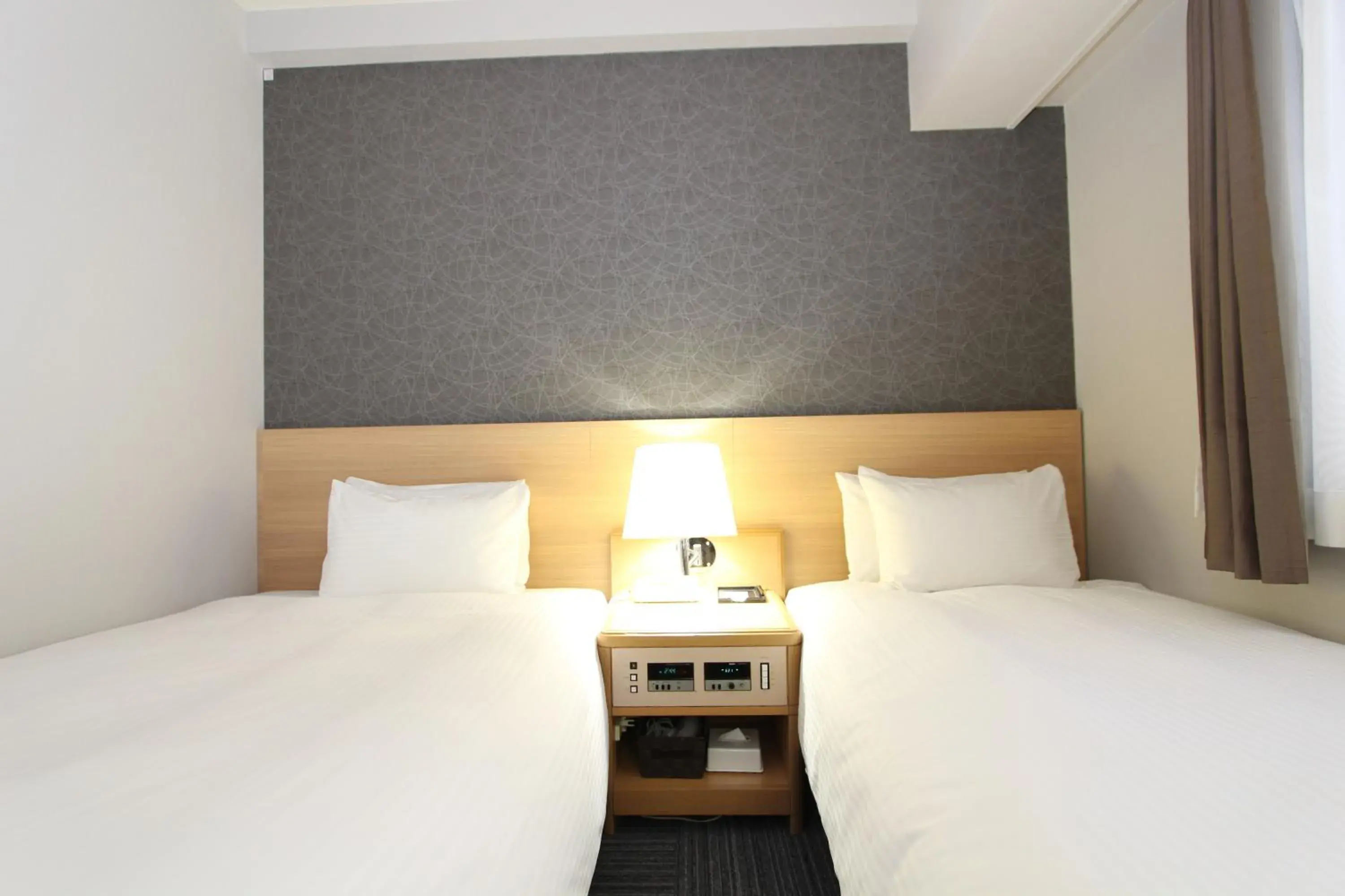 Bed in SureStay Plus Hotel by Best Western Shin-Osaka