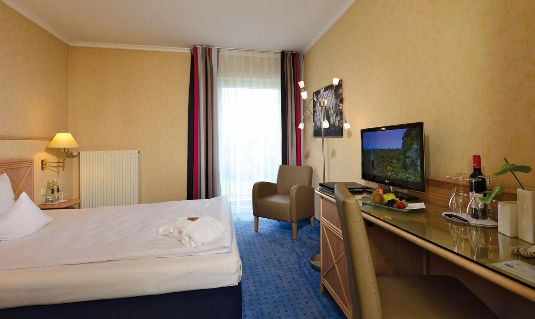 Photo of the whole room, Bed in Parkhotel Weiskirchen