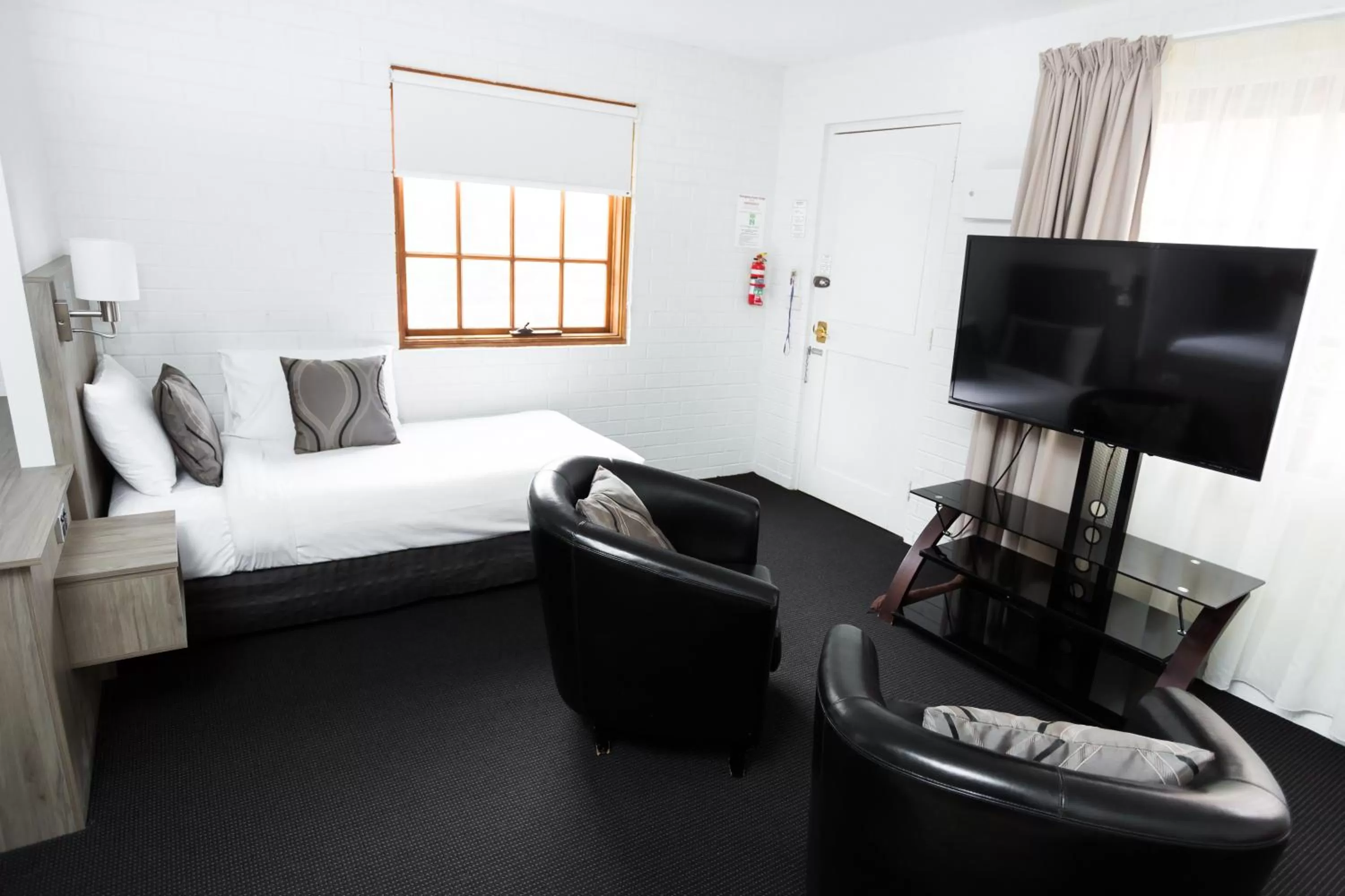 Living room, Bed in Bay Hotel Apartments