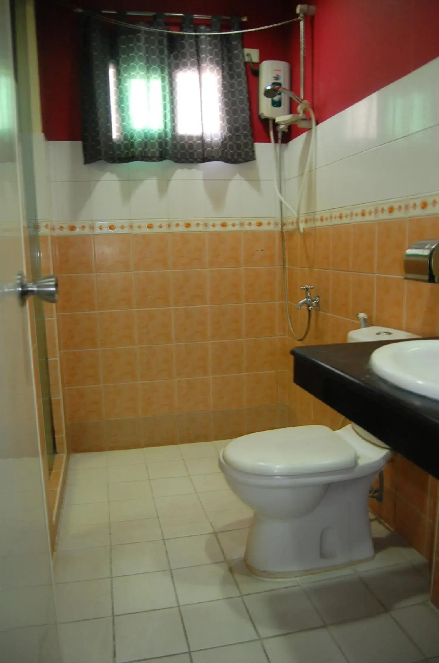 Bathroom in Rumi Apartelle Hotel