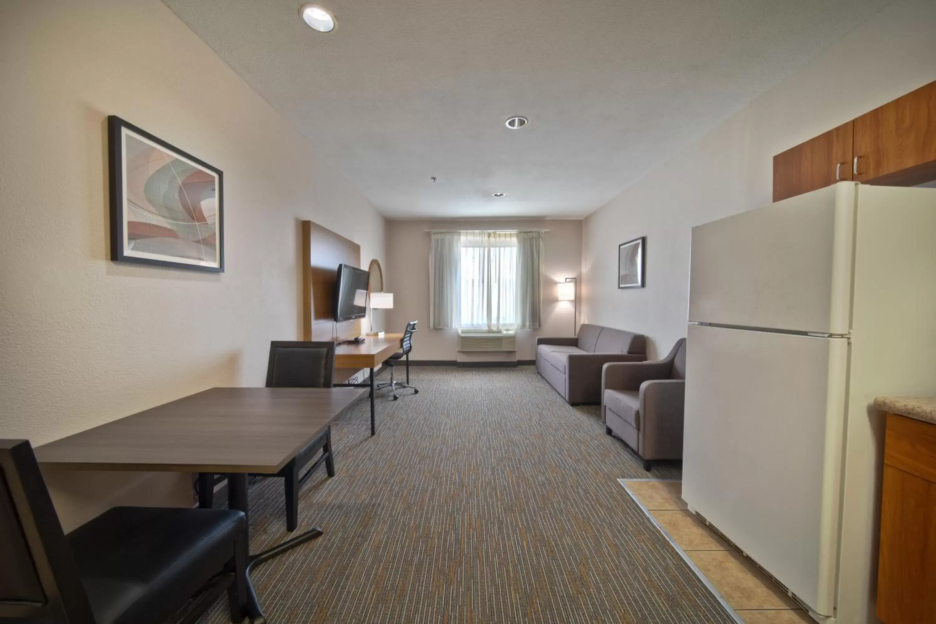 Living room, Seating Area in Wingate by Wyndham Houston Bush Intercontinental Airport