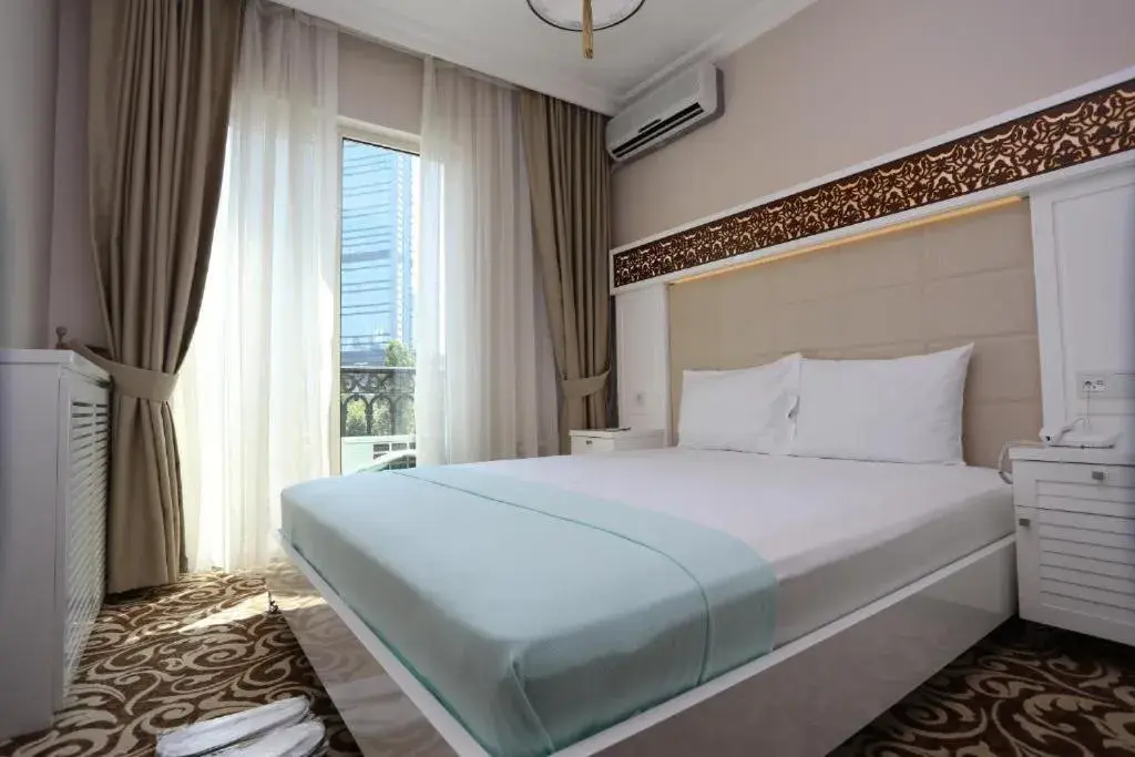 Bedroom, Bed in K Suites Hotel
