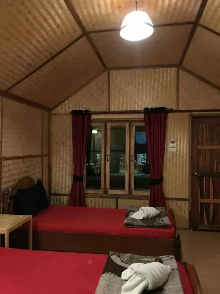 Bed in Bamboo House Resort Bed in Bamboo House Resort