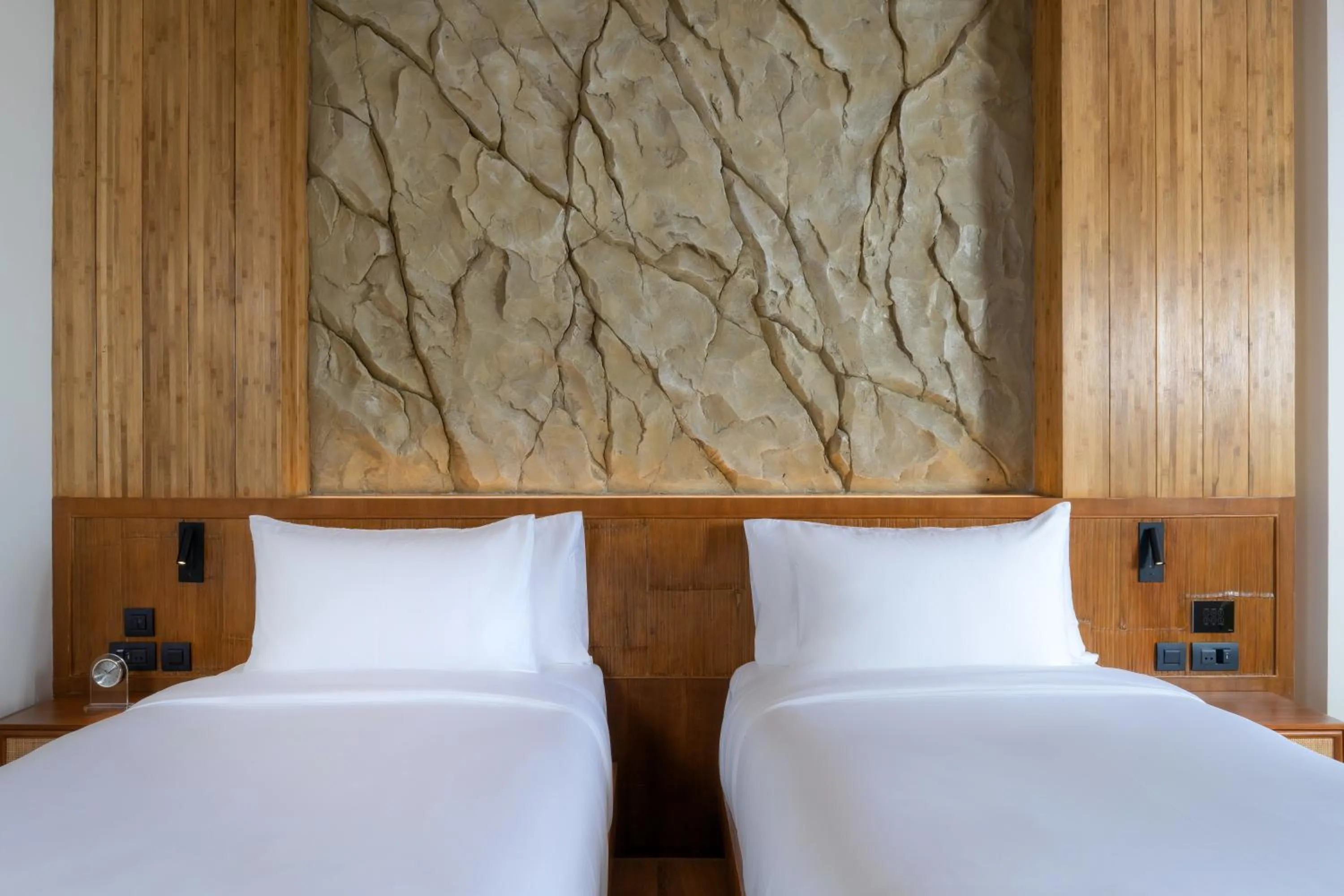 Bed in SINAE Phuket Luxury Hotel