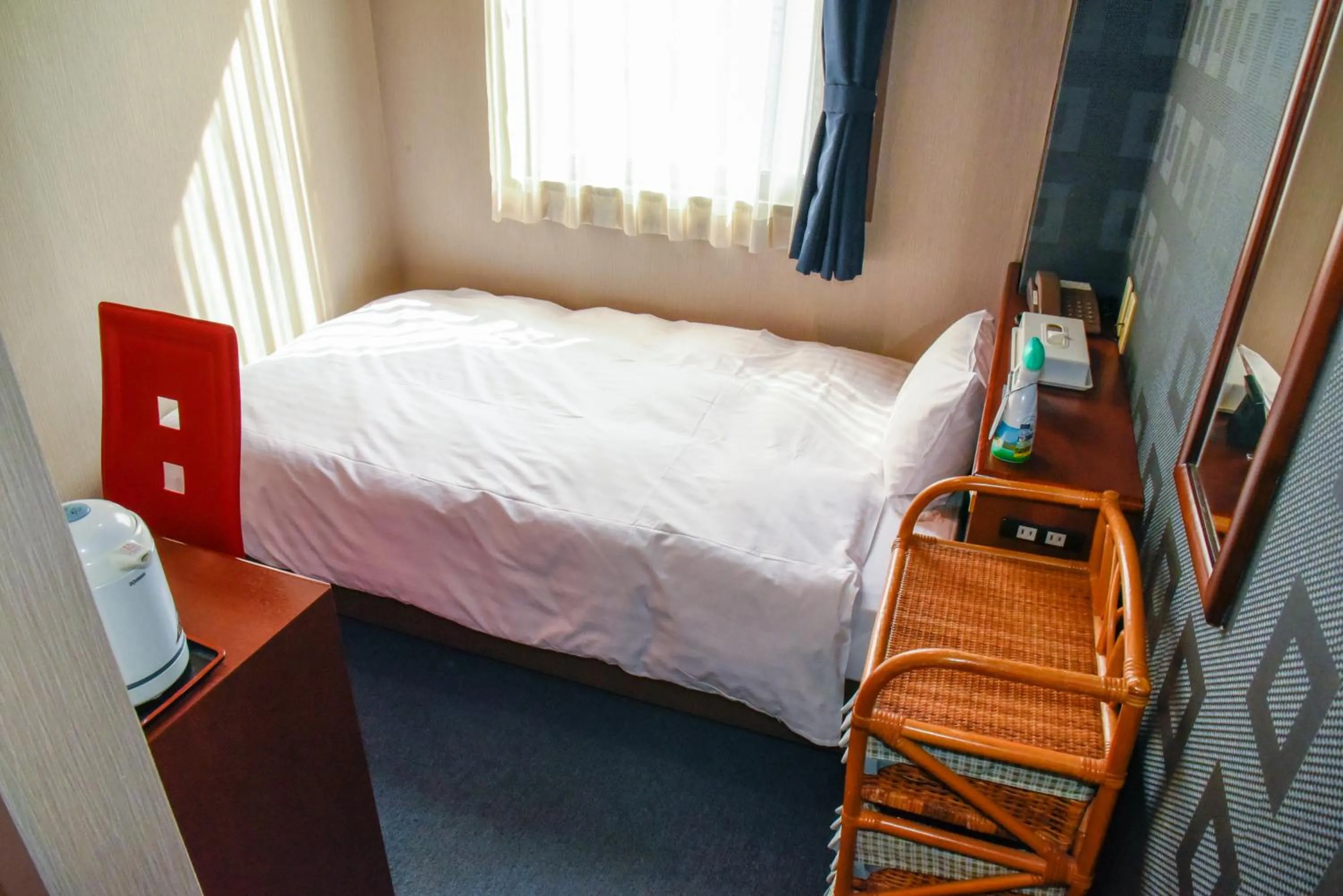 Bed in Hotel Palms Tenmonkan