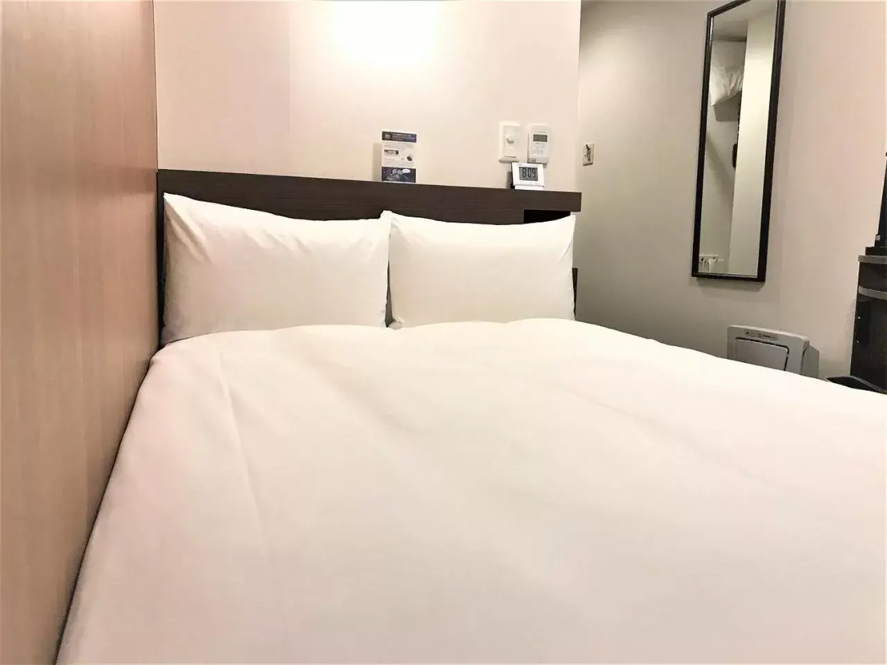 Bed in Smile Hotel Mito