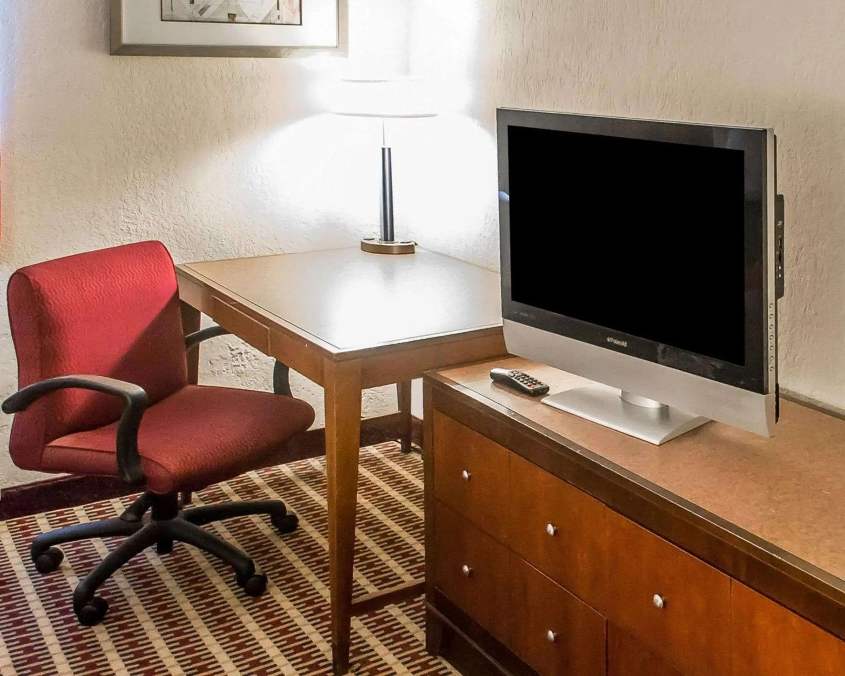 Photo of the whole room, TV/Entertainment Center in Economy Inn & Suites