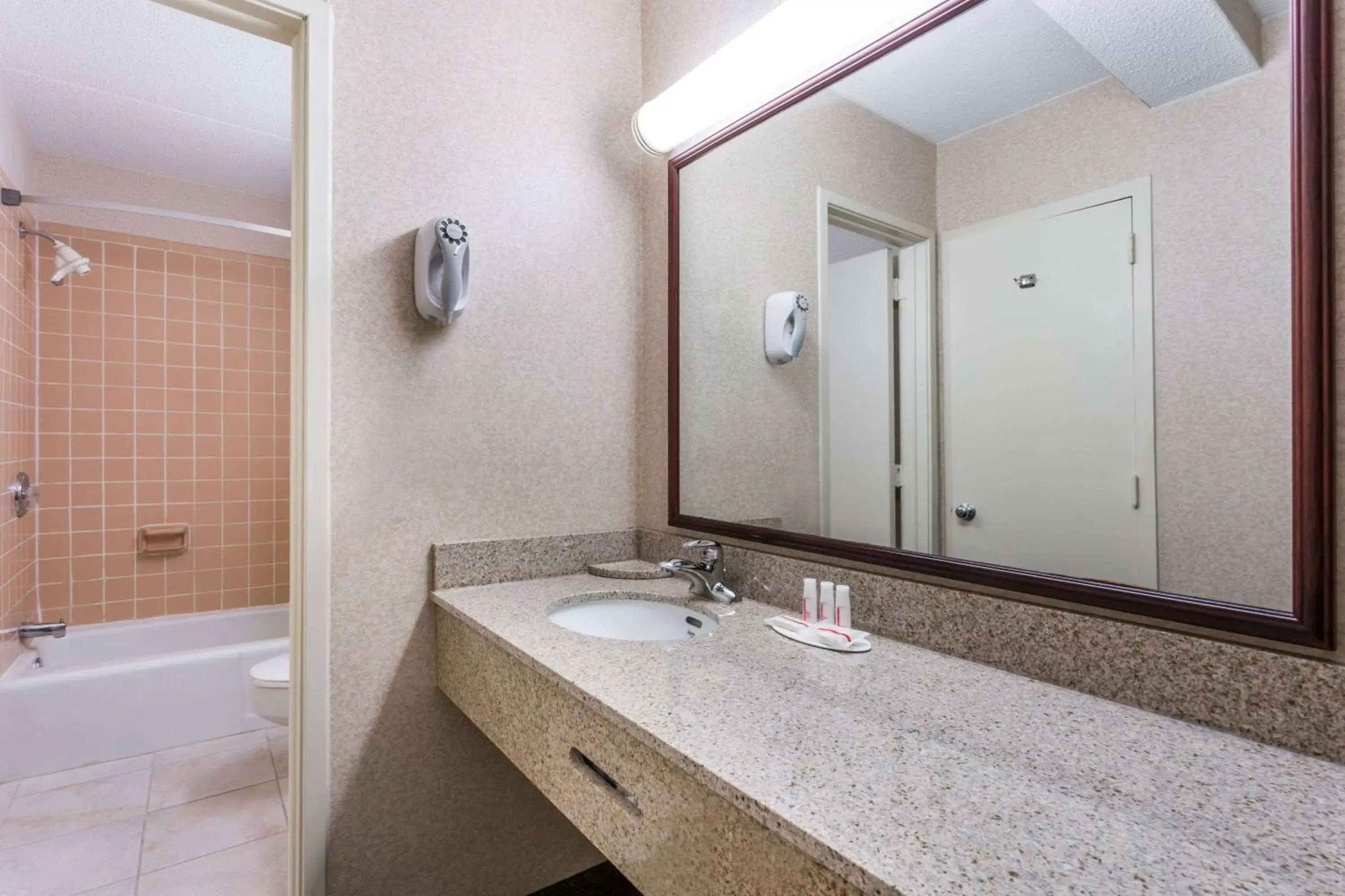 Bathroom in Ramada by Wyndham Triangle/Quantico